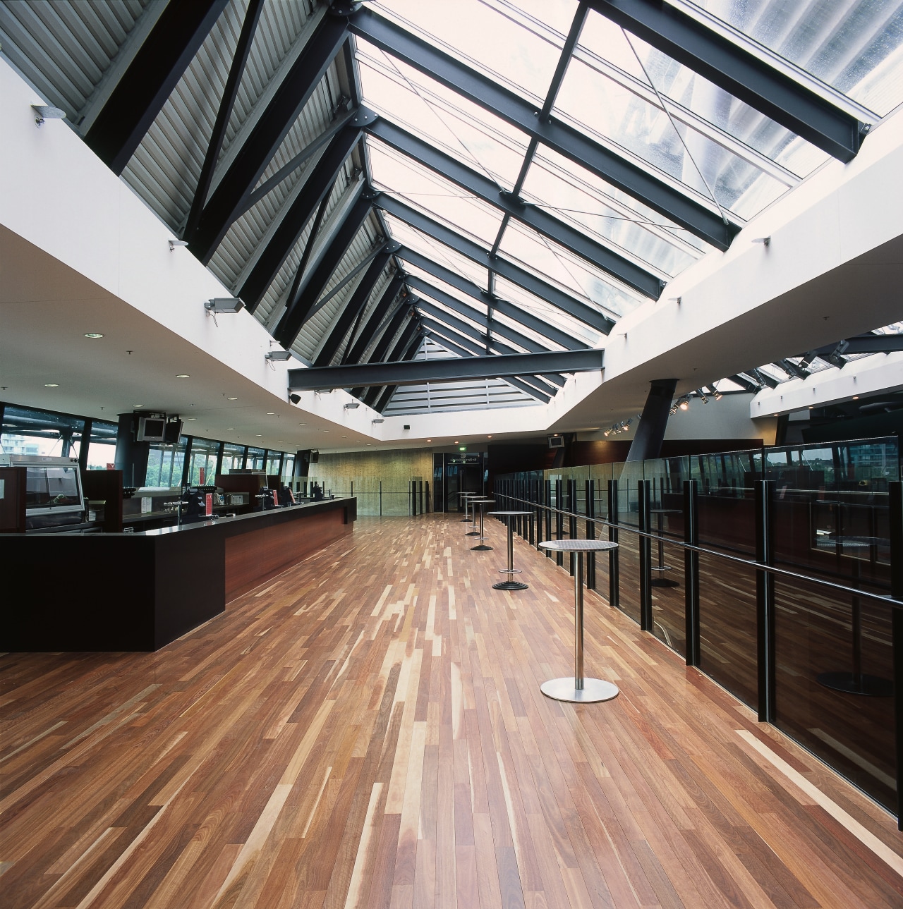 Large bar area with glass roof panels and architecture, building, ceiling, daylighting, floor, flooring, interior design, lobby, roof, structure, wood, black, white