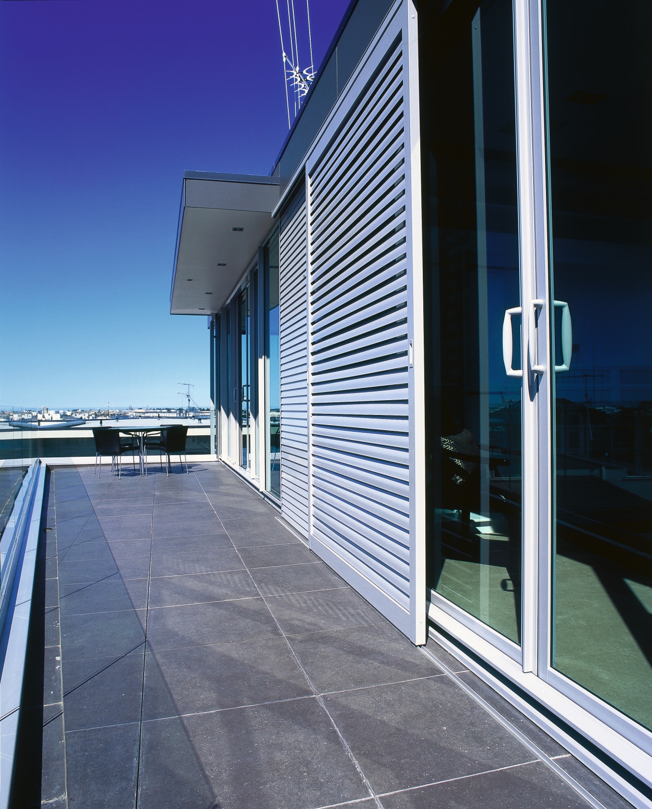 A view of some cladding from Maxwells. architecture, building, corporate headquarters, daylighting, daytime, facade, glass, house, real estate, sky, structure, window, gray, blue