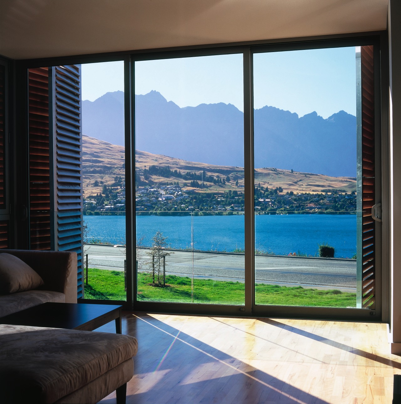 Large window with aluminium joinery and timber shutters, apartment, condominium, door, estate, home, interior design, property, real estate, sea, sky, window, window treatment, black