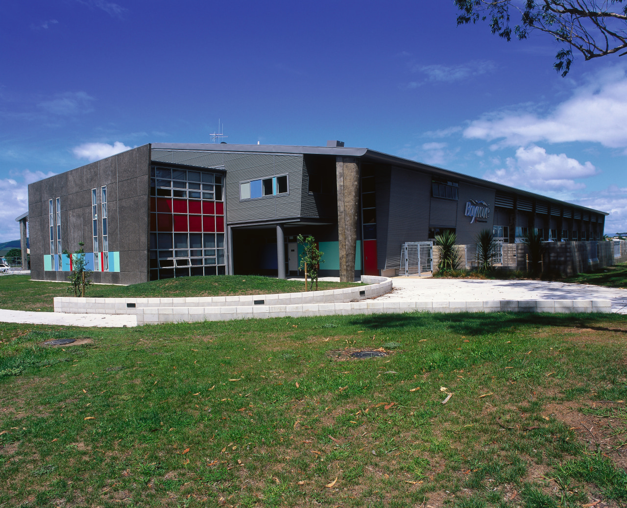 Exterior view of aquatic and leisure centre with architecture, building, commercial building, corporate headquarters, facade, real estate, sky, blue