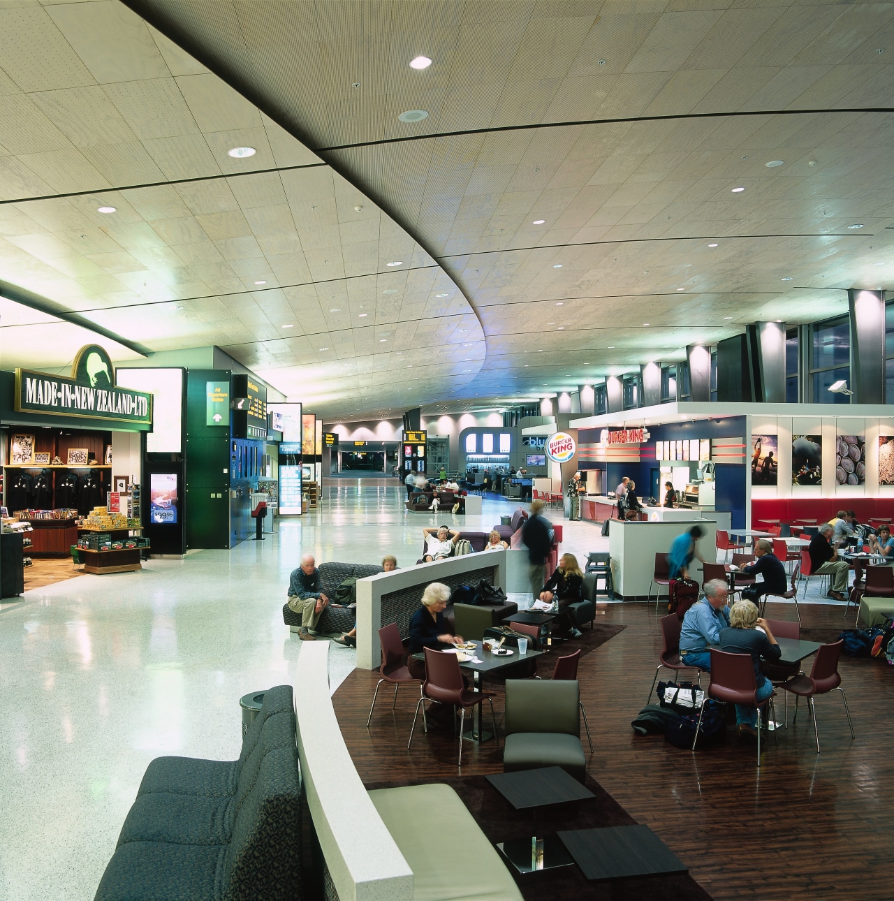 Interior view of airport complex passenger area. airport terminal, food court, institution, interior design, retail, shopping mall, black