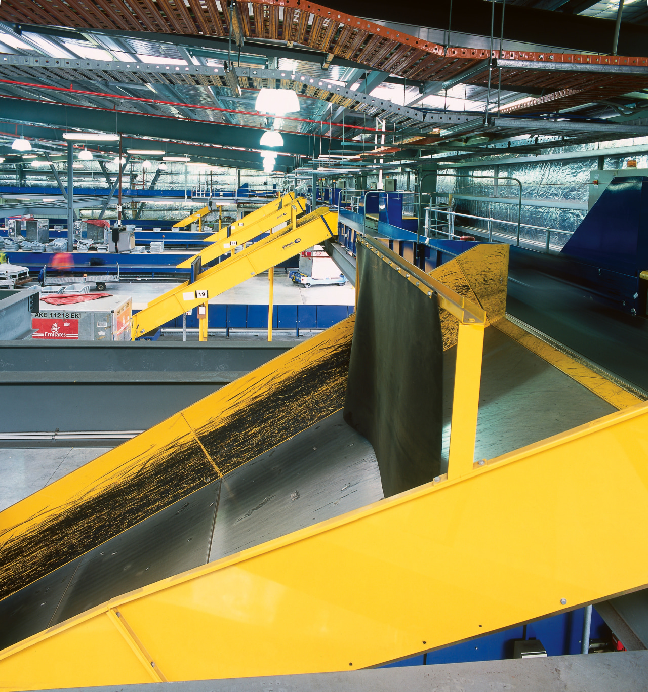 View of airport baggage handling equipment. yellow, yellow