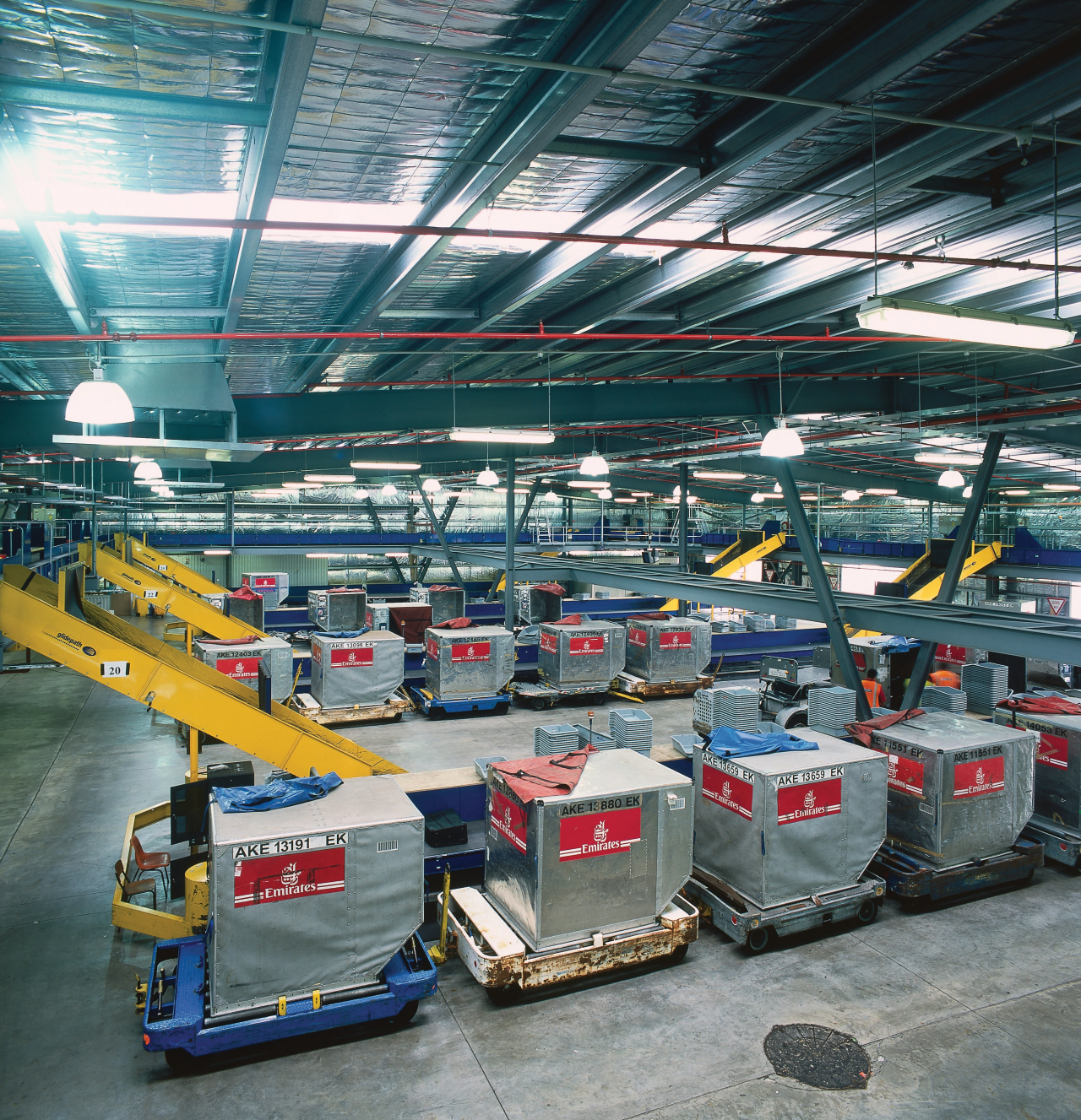 View of baggage handling equipment in building at factory, manufacturing, motor vehicle, gray, black