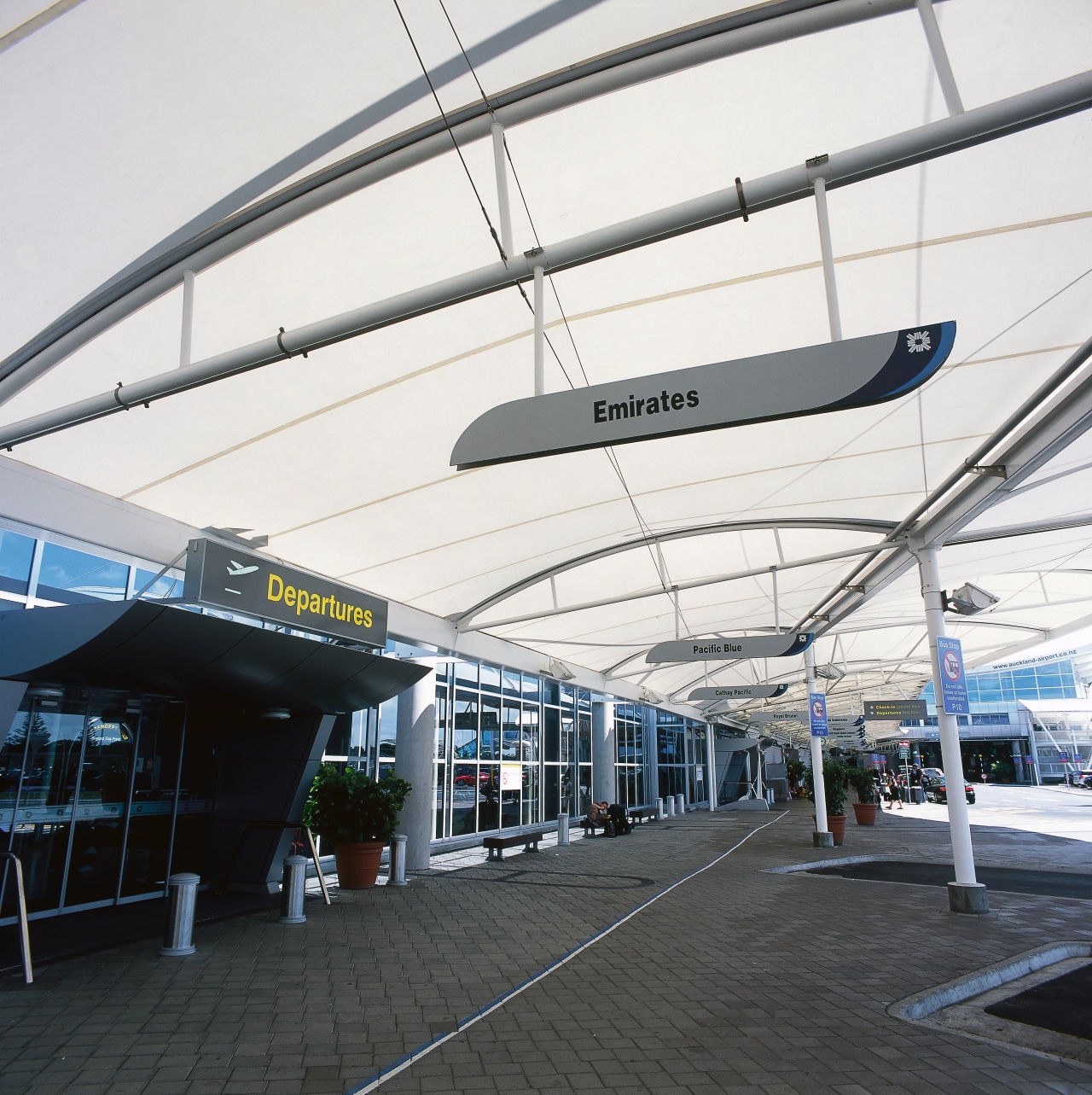 View of large sail-like canopy providing shelter outside airport terminal, building, structure, white, black