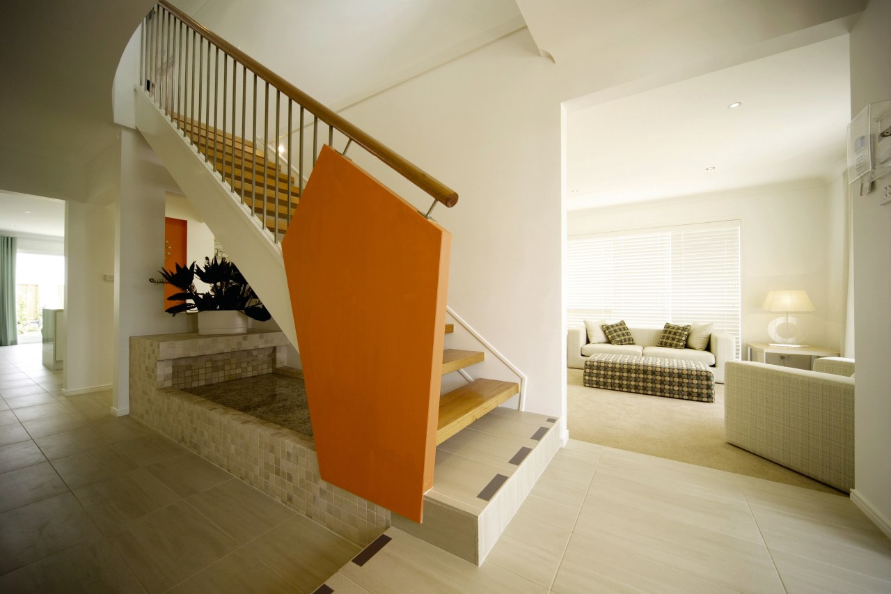 A view of a Clarendon Home. architecture, daylighting, estate, floor, flooring, handrail, hardwood, home, house, interior design, property, real estate, stairs, wood, wood flooring, orange, brown