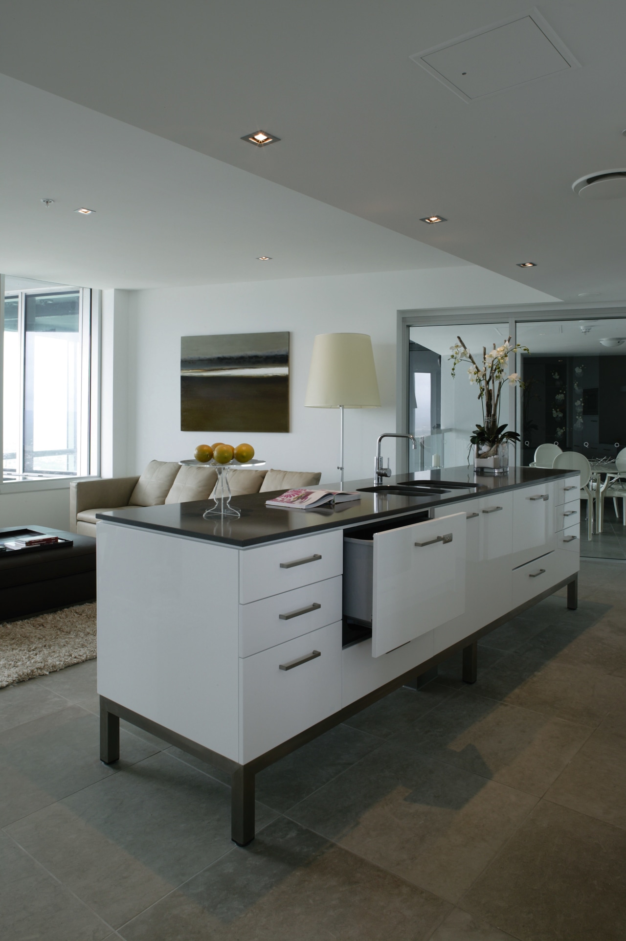 Kitchen with white cabinetry and black benchtop, and countertop, floor, flooring, interior design, kitchen, gray, black