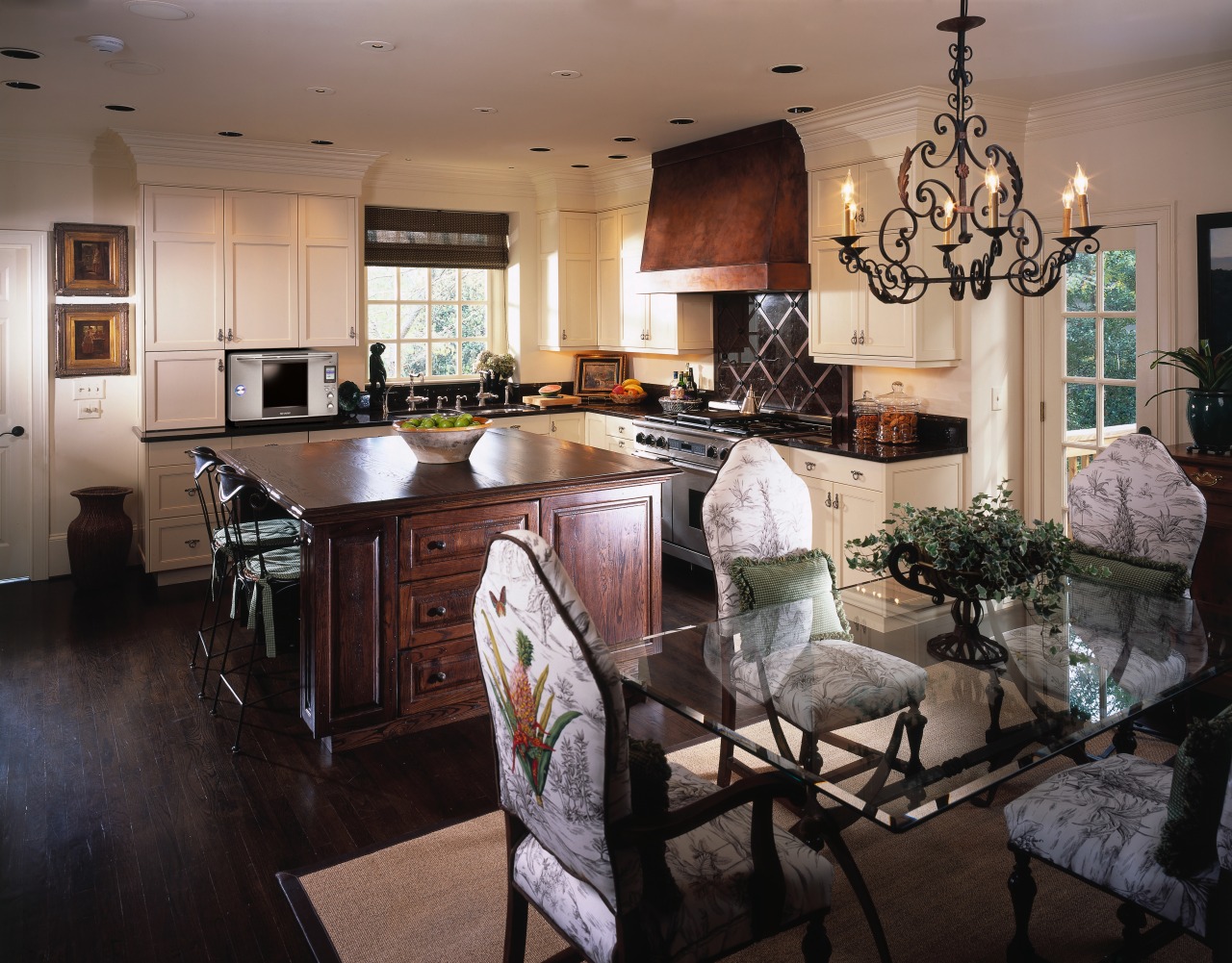 Traditional style kitchen and dining room showing steam countertop, dining room, interior design, kitchen, living room, room, black