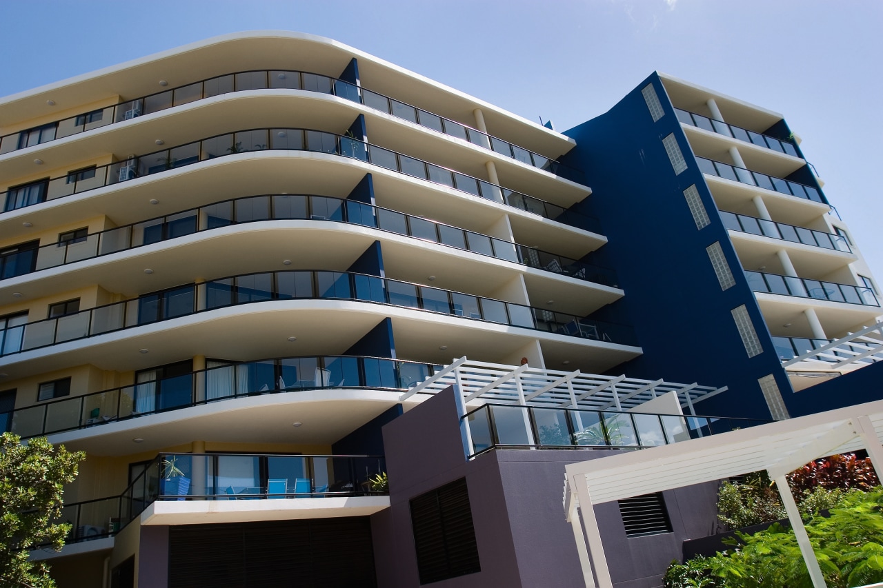 A view of an apartment complex with Kleenmaid apartment, architecture, building, commercial building, condominium, corporate headquarters, daytime, elevation, facade, headquarters, hotel, house, metropolitan area, mixed use, property, real estate, residential area, sky, tower block