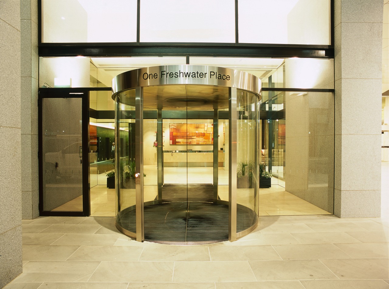 view of the entrance to freshwater place featuring door, brown, orange, yellow