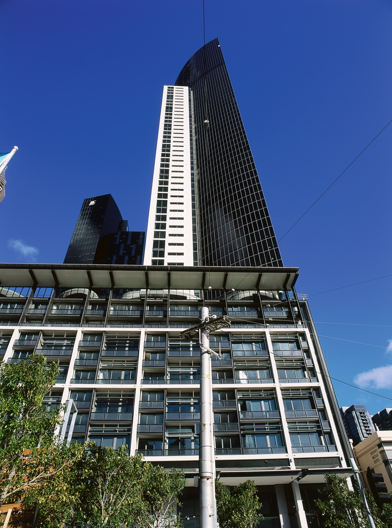 view of the freshwater place tower, where the architecture, building, city, commercial building, condominium, corporate headquarters, daytime, downtown, facade, landmark, metropolis, metropolitan area, residential area, sky, skyscraper, tower, tower block, urban area, blue, black