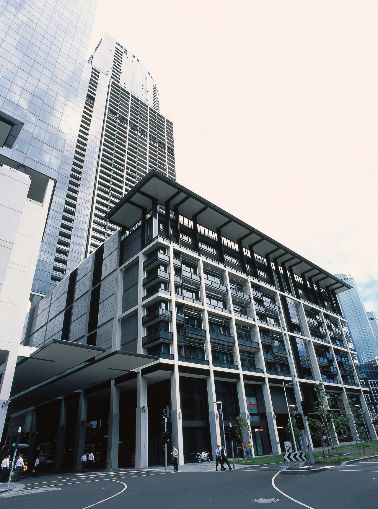 view of the curtain wall facade at freshwater architecture, brutalist architecture, building, city, commercial building, condominium, corporate headquarters, daytime, downtown, facade, headquarters, infrastructure, landmark, metropolis, metropolitan area, mixed use, neighbourhood, sky, skyscraper, structure, tower block, urban area, white, black, gray