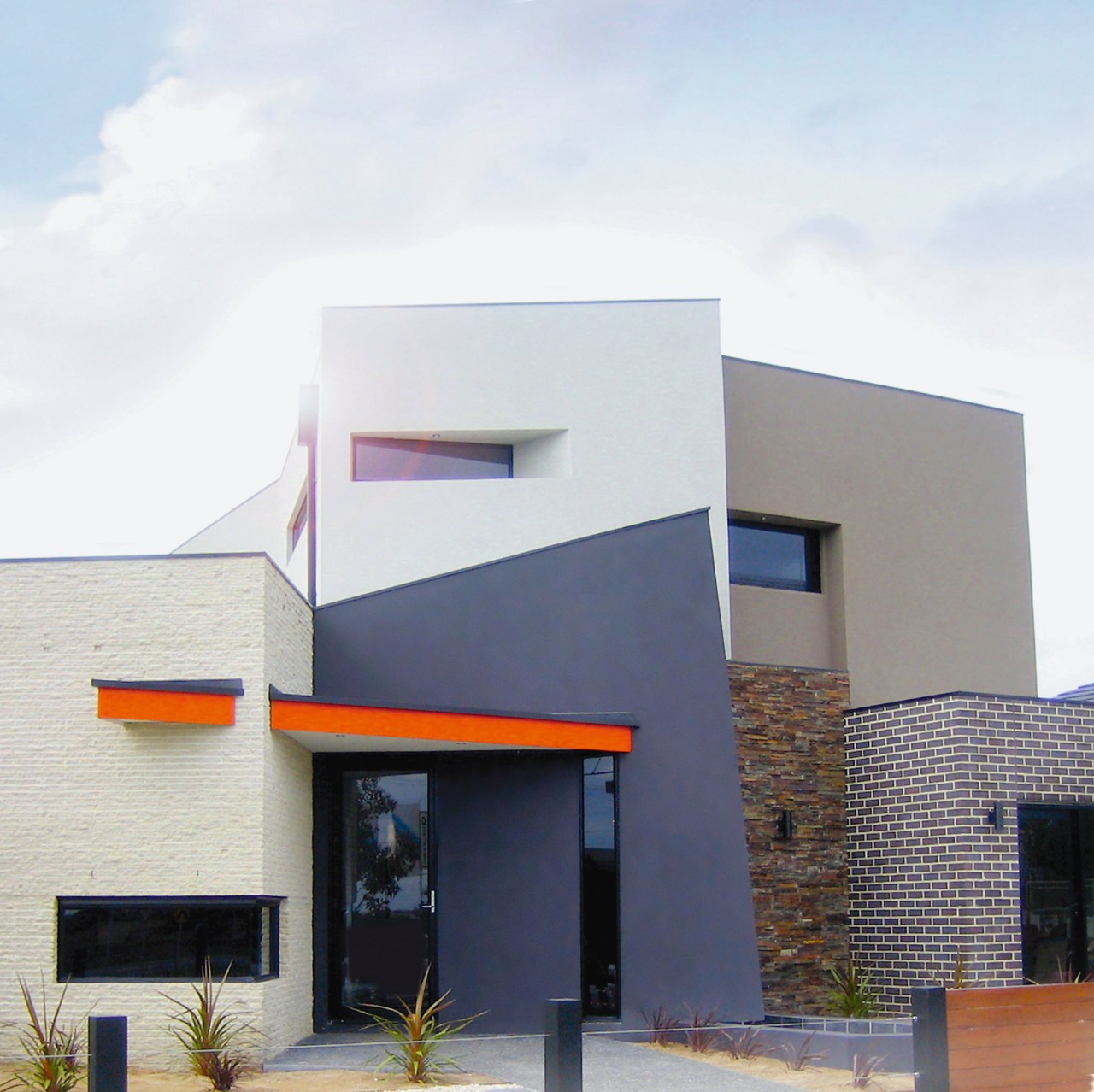 An exterior view of a NSD home. architecture, building, commercial building, elevation, facade, home, house, property, real estate, white