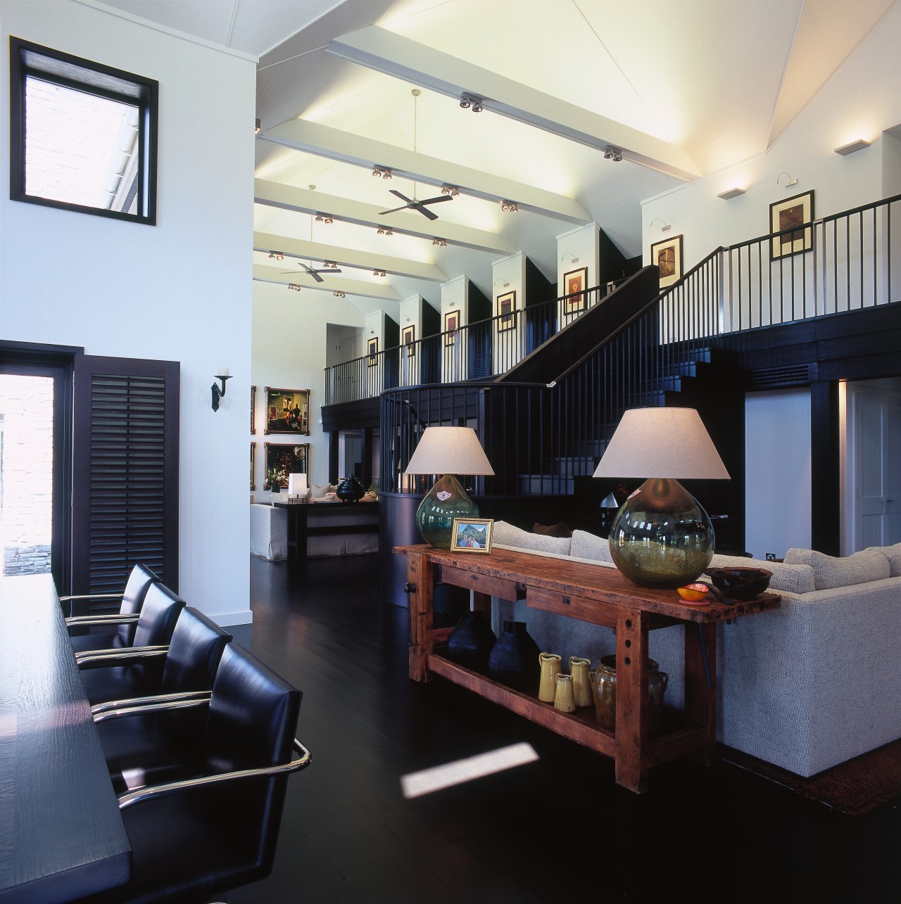 View of open-plan living areas with dark stained ceiling, interior design, living room, loft, real estate, room, black