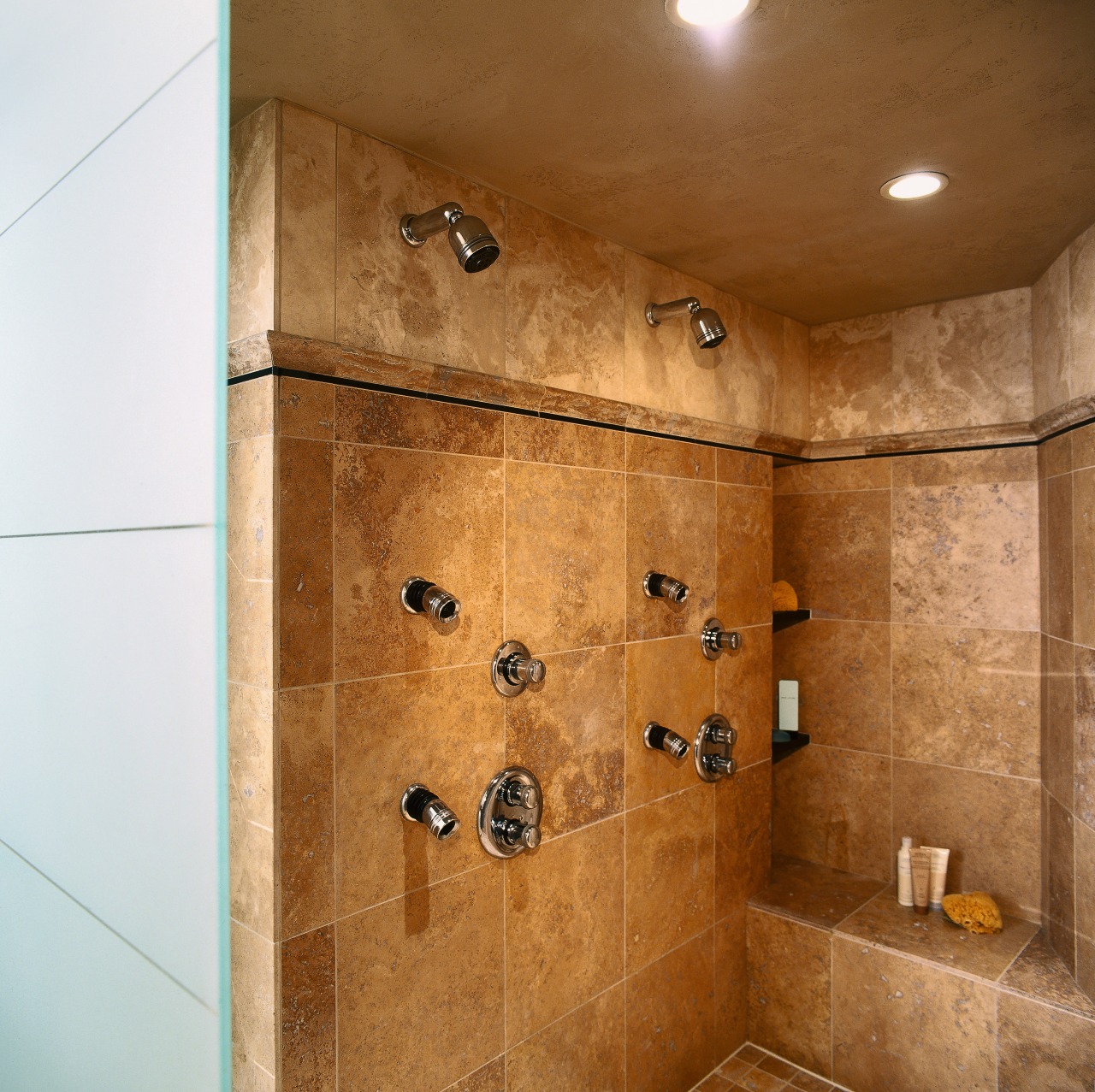 view of this bathrom featuring a noritz tankless bathroom, ceiling, floor, flooring, interior design, plumbing fixture, room, shower, tile, wall, brown