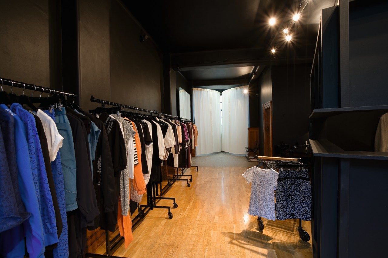 A view of a store, wooden flooring. boutique, interior design, room, black