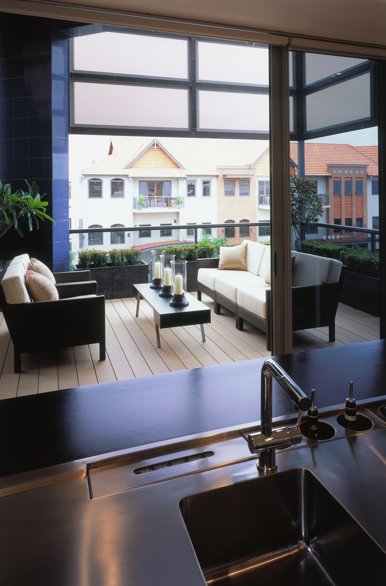 view of the outdoor entertainment area featuring cane architecture, daylighting, furniture, interior design, living room, table, window, black