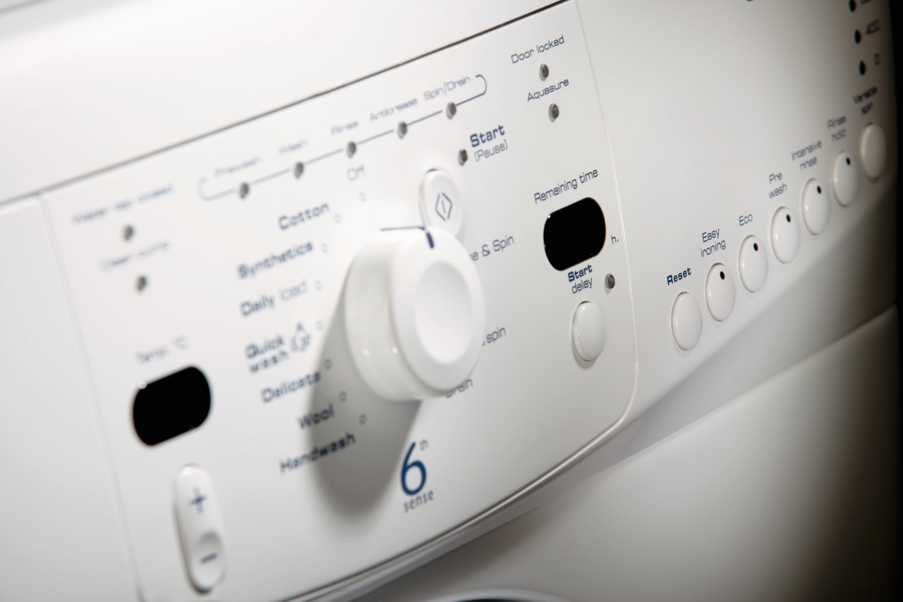 A view of a dryer. design, font, home appliance, major appliance, product, product design, washing machine, white