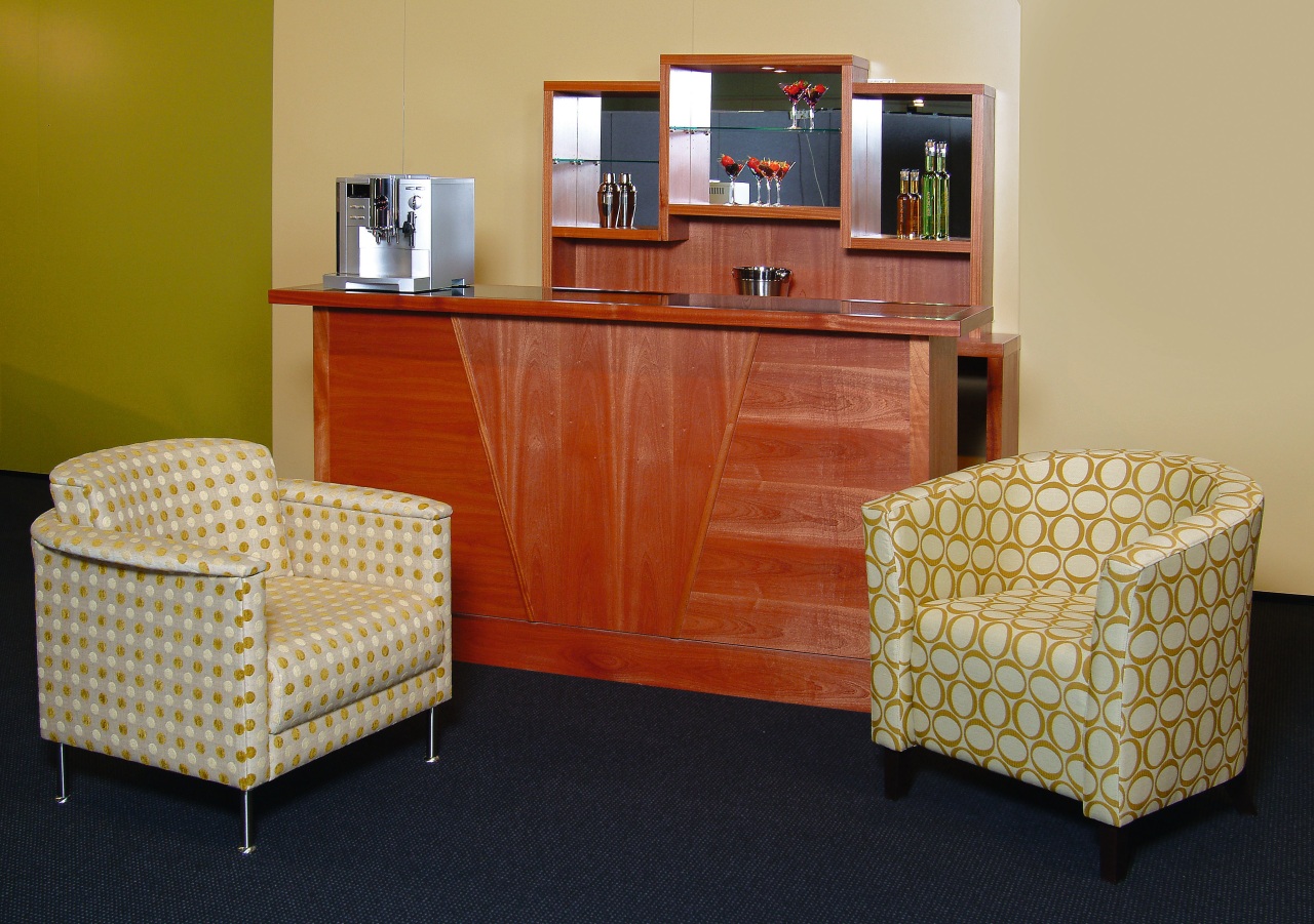 Upholstered chairs and timber cabinet. chair, chest of drawers, desk, flooring, furniture, interior design, living room, room, table, orange