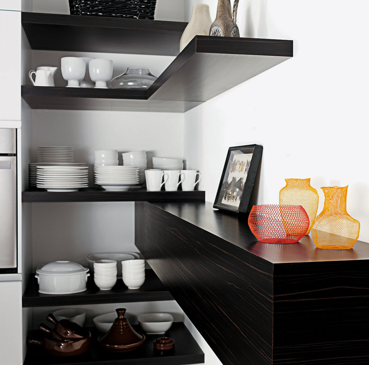 A view of a laminated benchtop. furniture, home appliance, interior design, kitchen, product design, shelf, shelving, white, black