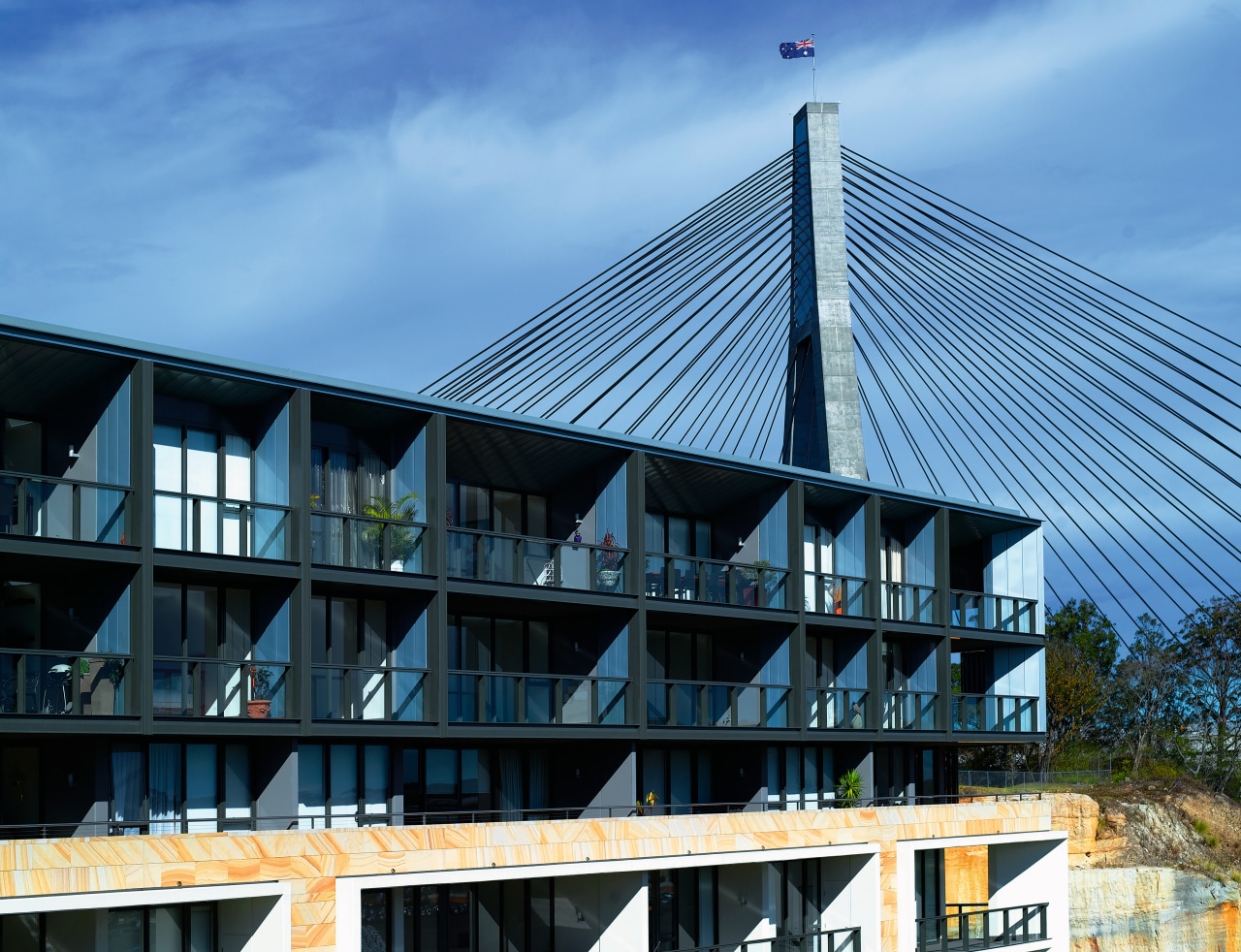 Exterior view of apartment building showing metal titanium architecture, building, condominium, corporate headquarters, facade, house, real estate, roof, sky, structure, teal, black