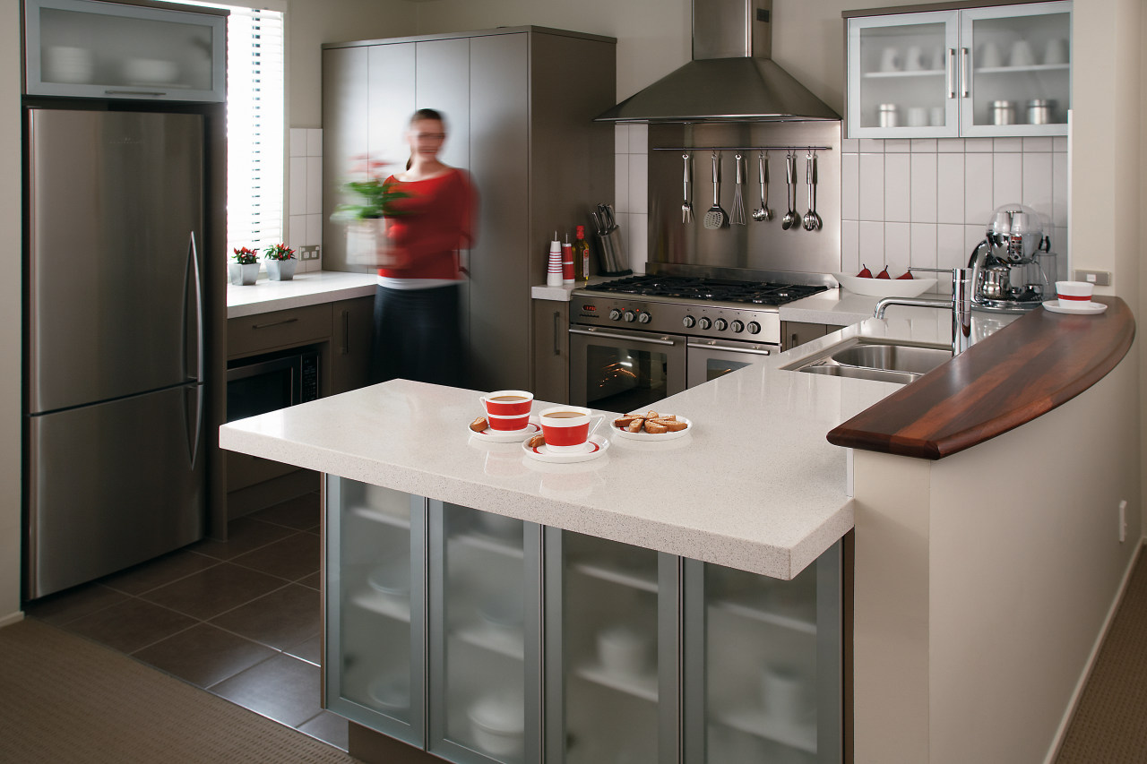 view of this kitchen featuring white granite benchtop, cabinetry, countertop, cuisine classique, home appliance, interior design, kitchen, room, gray, black