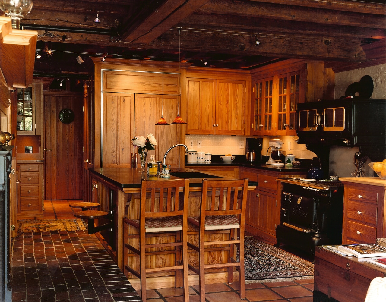 A view of some furniture by Longleaf Lumber cabinetry, countertop, furniture, interior design, kitchen, wood, red, brown