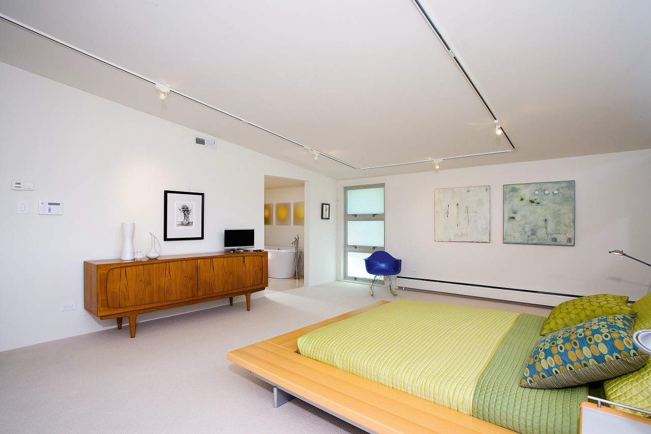 view of the master bedroom featuring carpet, timber architecture, bed frame, bedroom, ceiling, home, interior design, real estate, room, gray, white