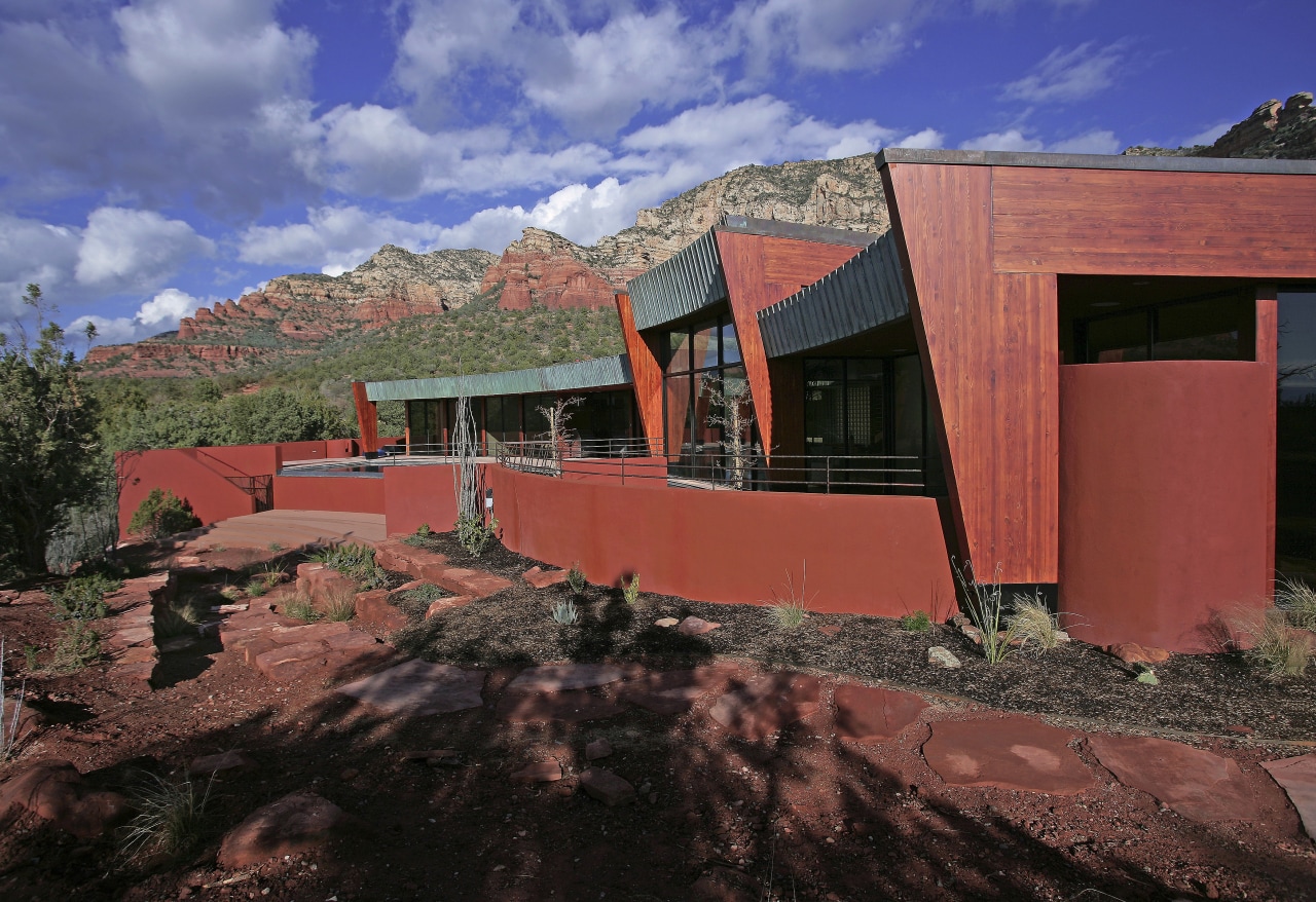 A view of a home built by Natura architecture, facade, hacienda, home, house, landscape, mountain, property, real estate, roof, sky, red, black