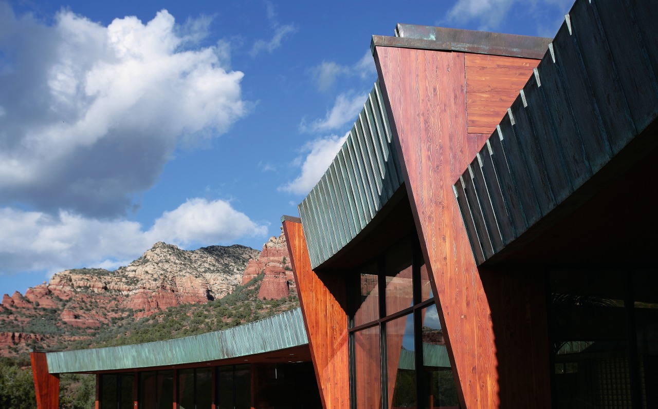 A view of an entrance way designed by architecture, building, cloud, facade, house, landmark, roof, sky, wood, black