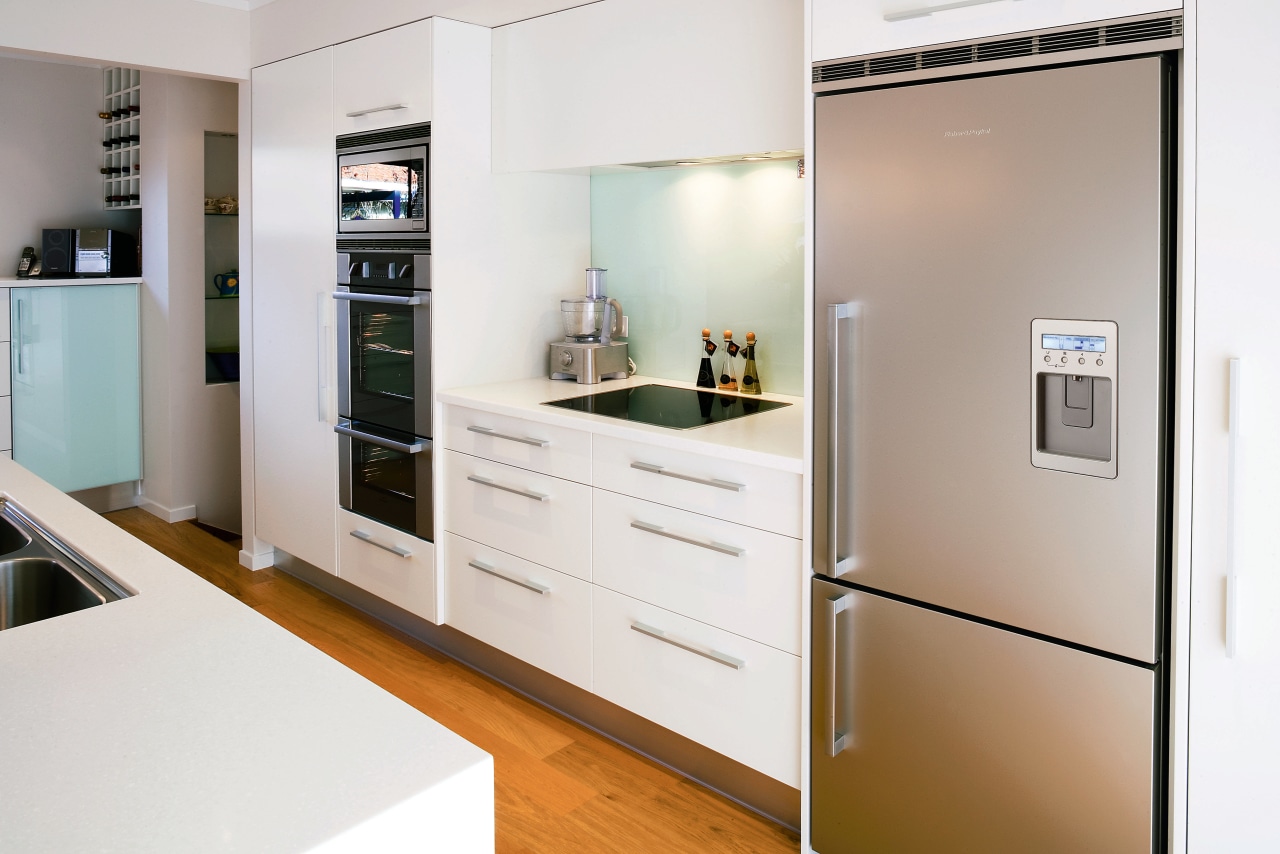 White kitchen with stainless steel refrigerator. countertop, home appliance, interior design, kitchen, major appliance, room, white