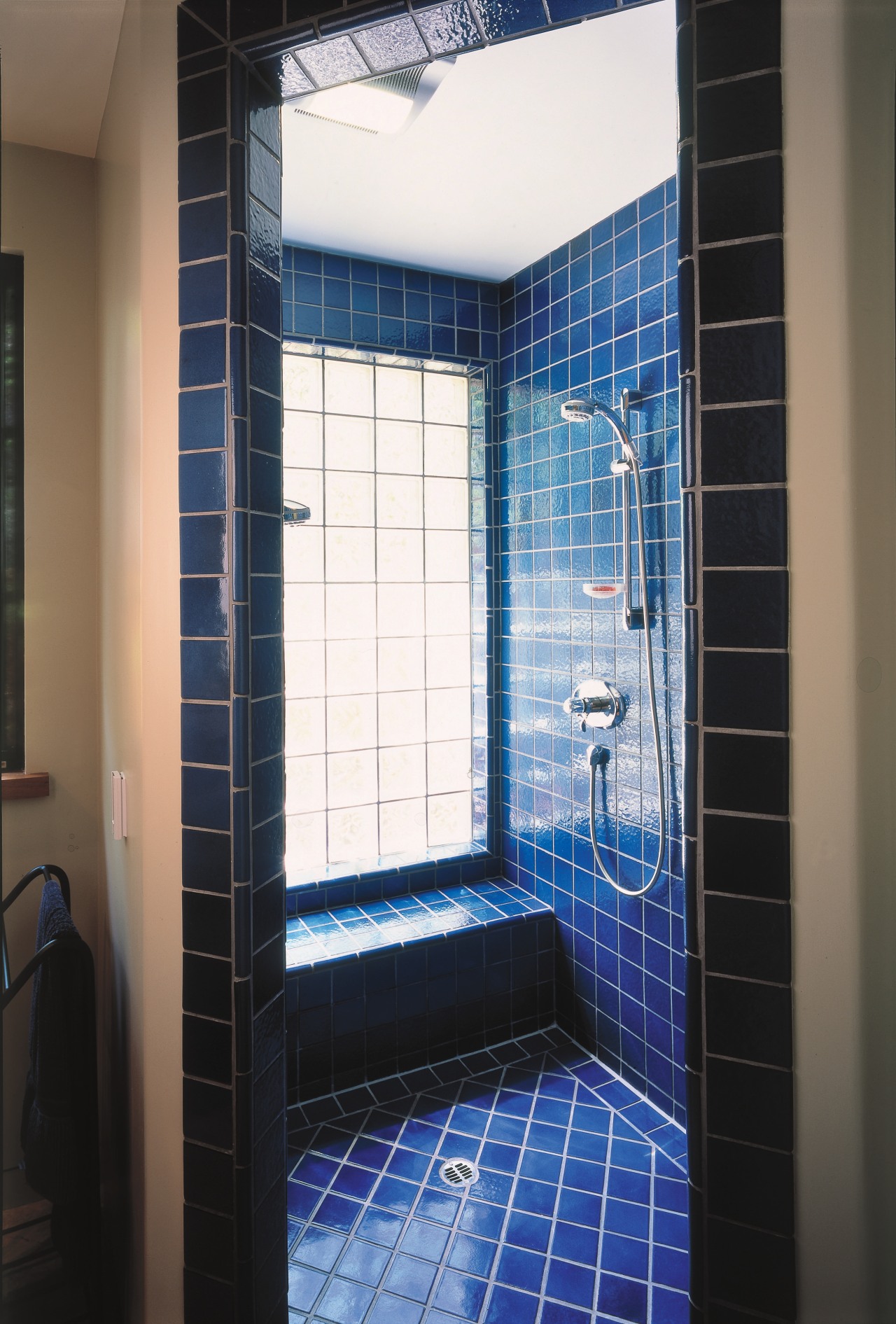 A view of a bathroom by Chadine Interior architecture, bathroom, blue, daylighting, floor, flooring, glass, interior design, room, tile, window, black