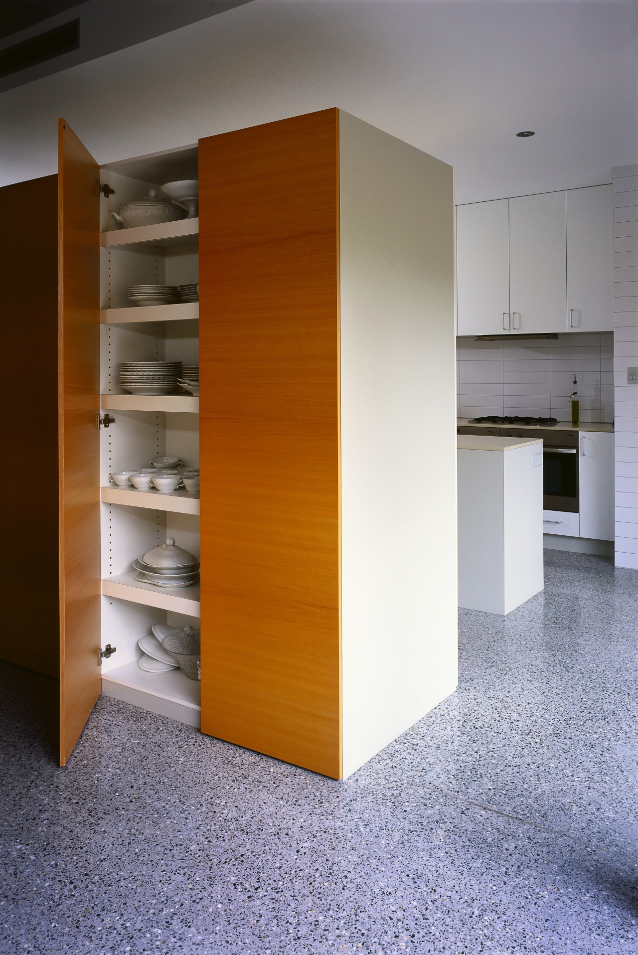 A view of the wooden pantry. chest of drawers, furniture, product design, shelf, shelving, gray