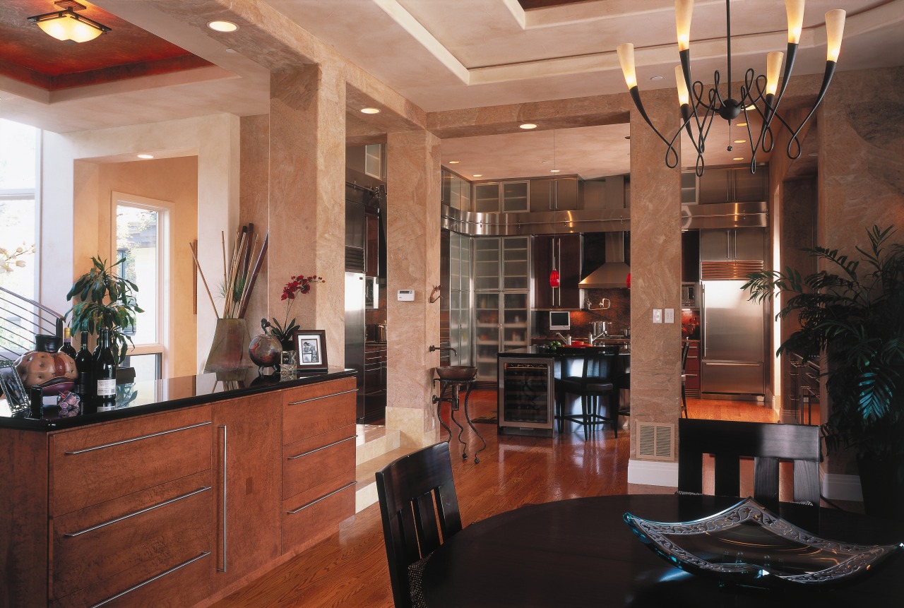 A view of the kitchen and didning areas. ceiling, dining room, interior design, lobby, real estate, room, brown, black
