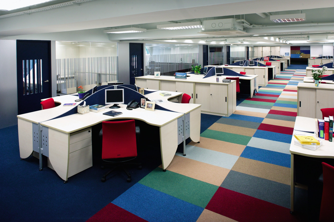 A view of the office, carpet. lights, workstations. furniture, interior design, office, gray