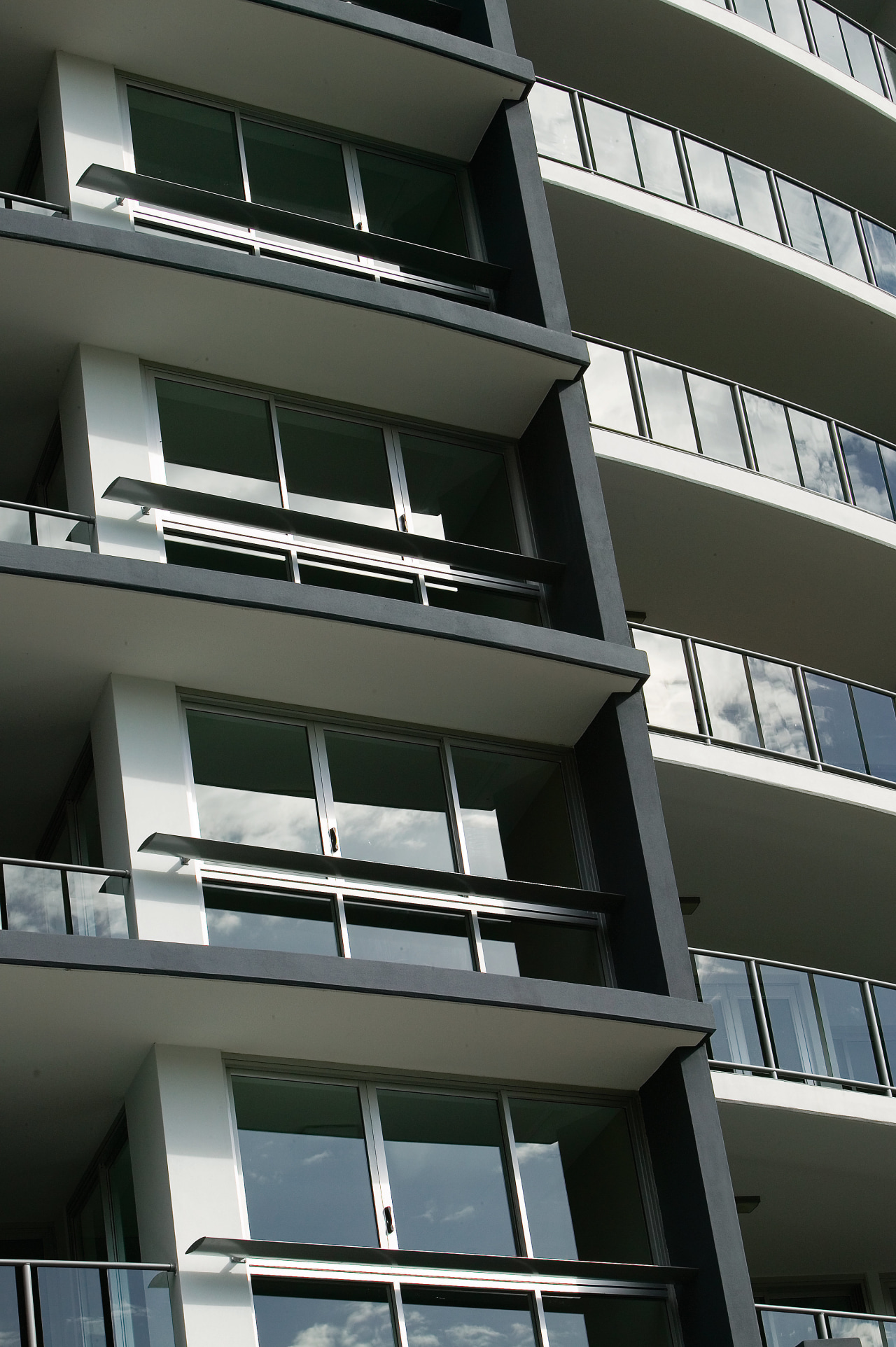 A view of some louvres from Lowline. angle, apartment, architecture, building, commercial building, condominium, corporate headquarters, daylighting, daytime, facade, glass, house, line, residential area, structure, window, black, gray