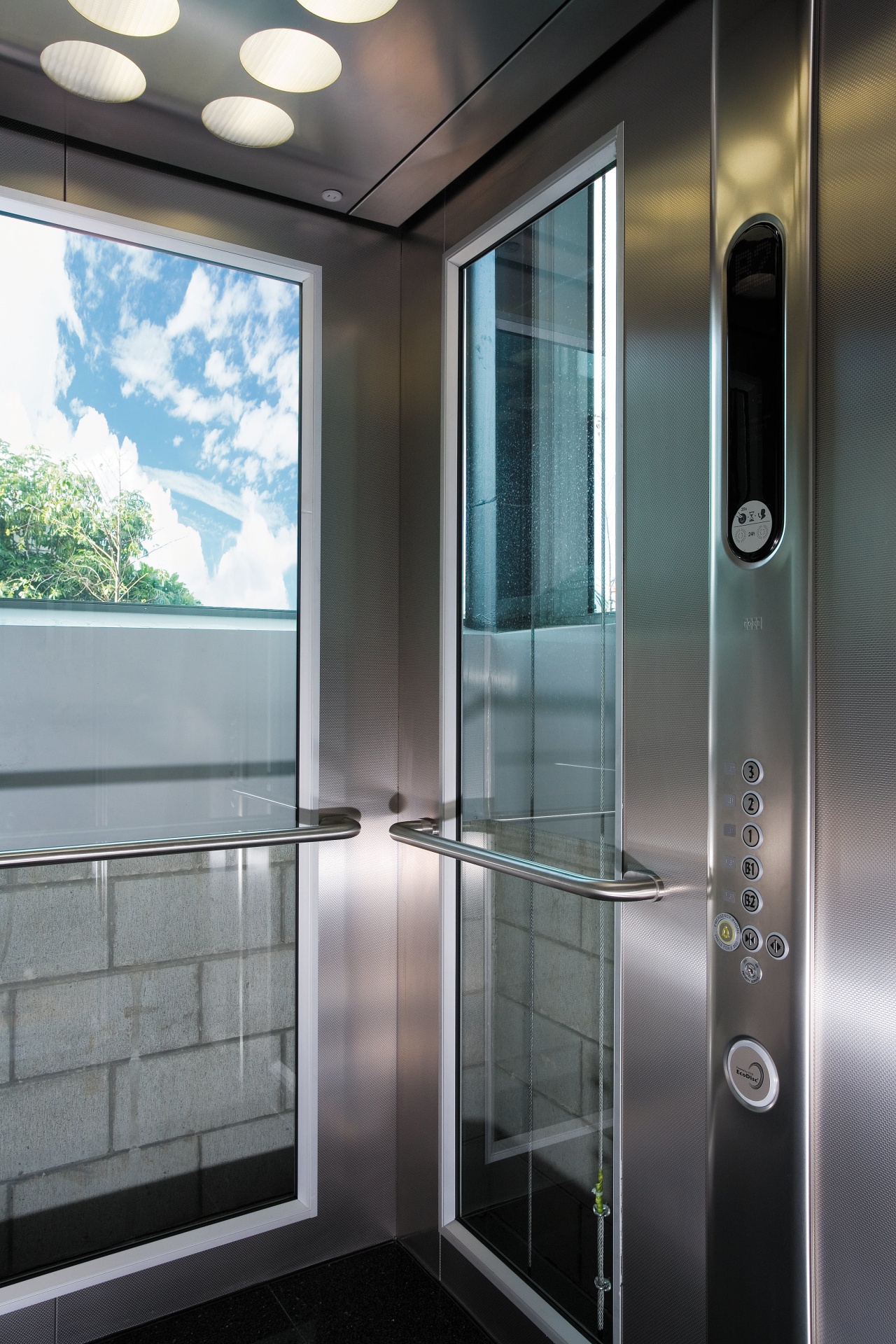 A view of a lift from Kone Elevators. glass, gray, black