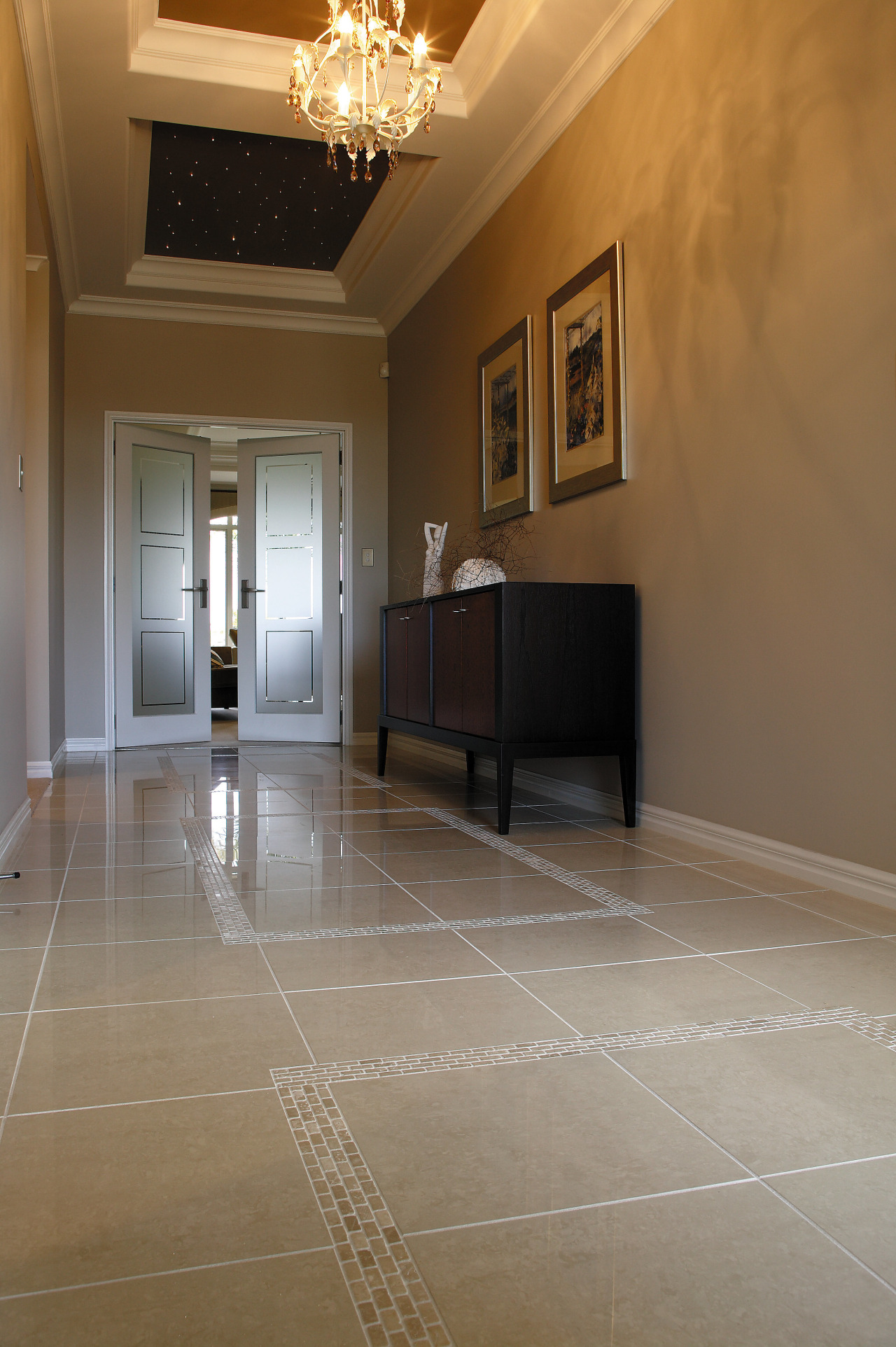 Large entranceway of home featuring porcelain and marble ceiling, estate, floor, flooring, hardwood, home, house, interior design, laminate flooring, lobby, property, real estate, room, tile, wall, wood, wood flooring, brown, gray