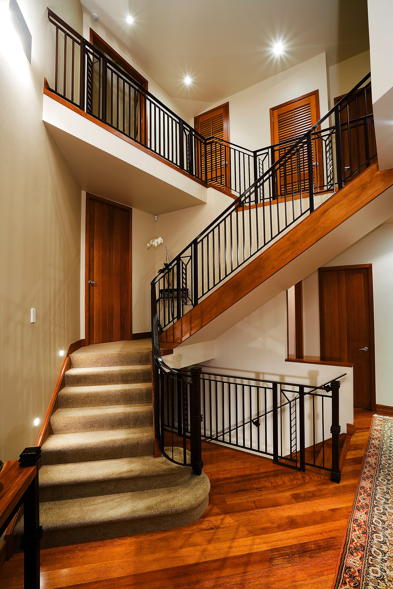 A view of a staircase from Knob's &amp; architecture, baluster, ceiling, daylighting, estate, floor, flooring, handrail, hardwood, home, interior design, lobby, real estate, stairs, wood, wood flooring, brown