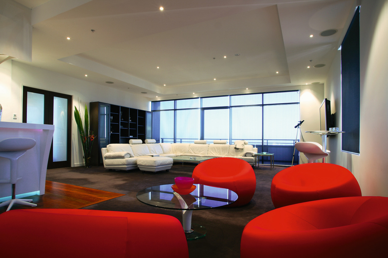 Large open plan apartment showing red chair seating architecture, ceiling, conference hall, interior design, lobby, real estate, room, gray