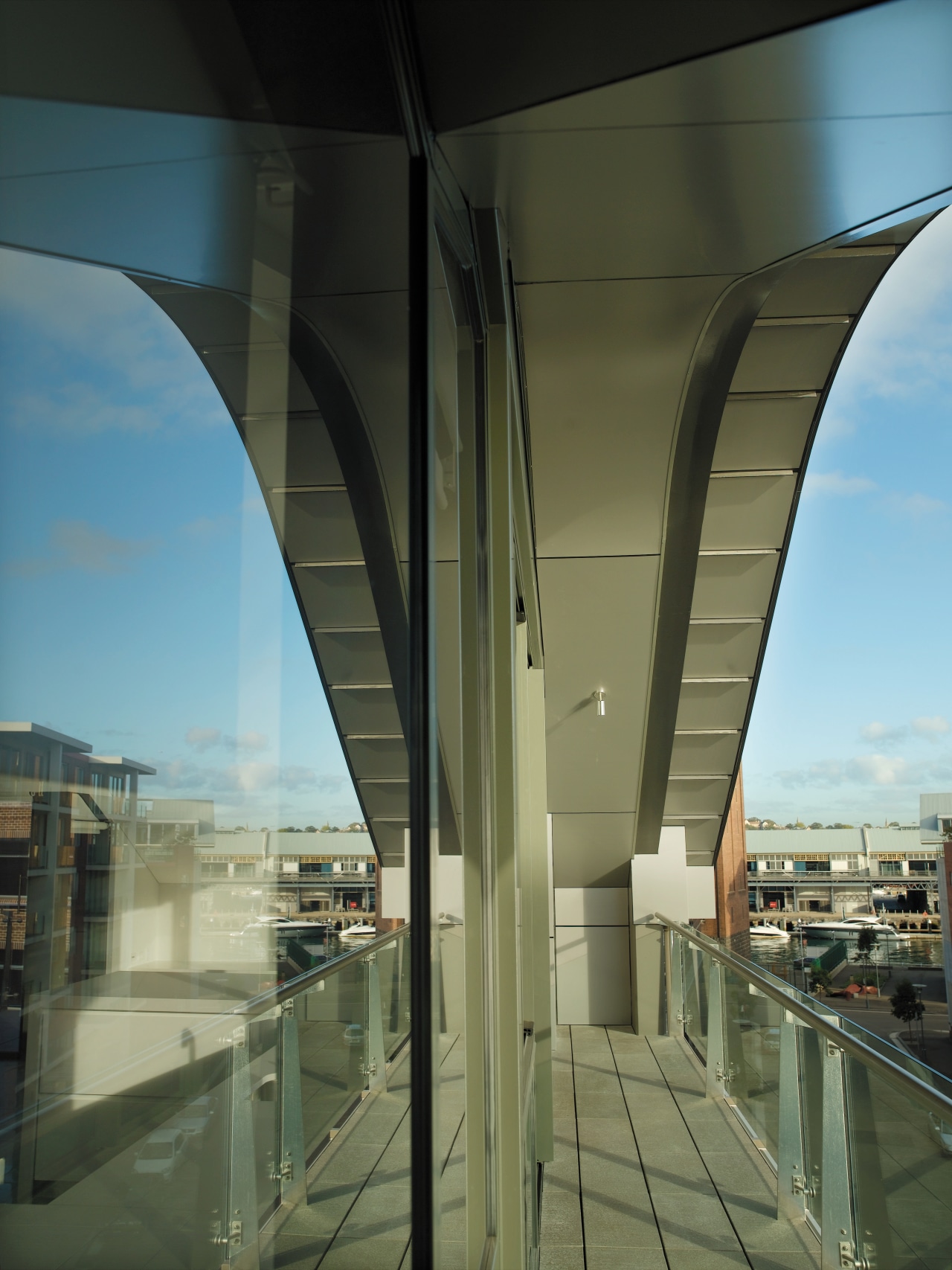 view of the balcony on the saunders wharf architecture, building, daytime, fixed link, glass, metropolitan area, reflection, sky, structure, brown