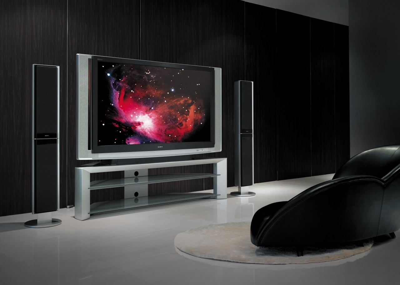 A view of a home audio system by display device, flat panel display, furniture, hearth, home appliance, interior design, living room, multimedia, product design, technology, television, black