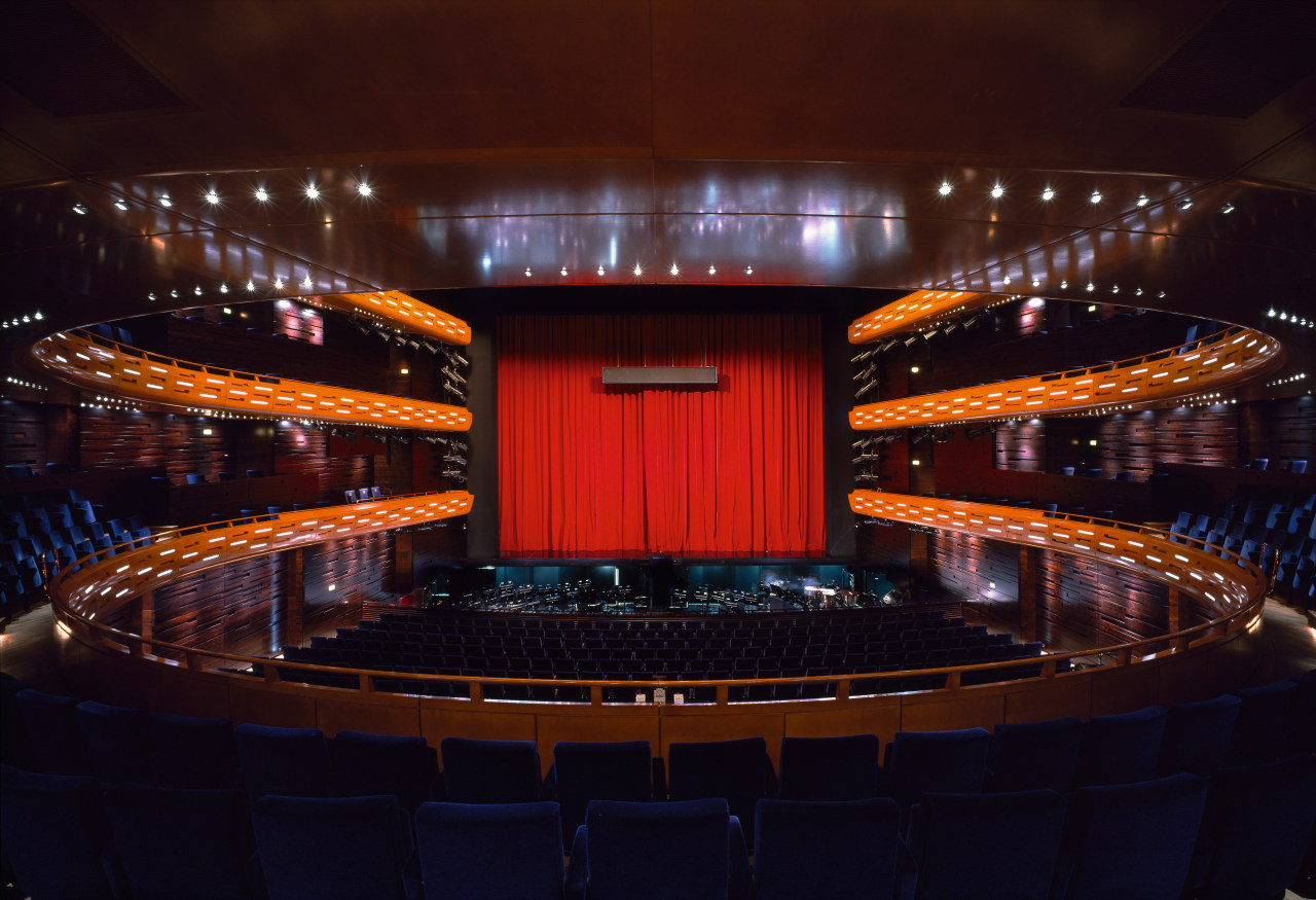 A view of the auditorium. auditorium, concert hall, entertainment, lighting, night, performing arts center, stage, theatre, red, black