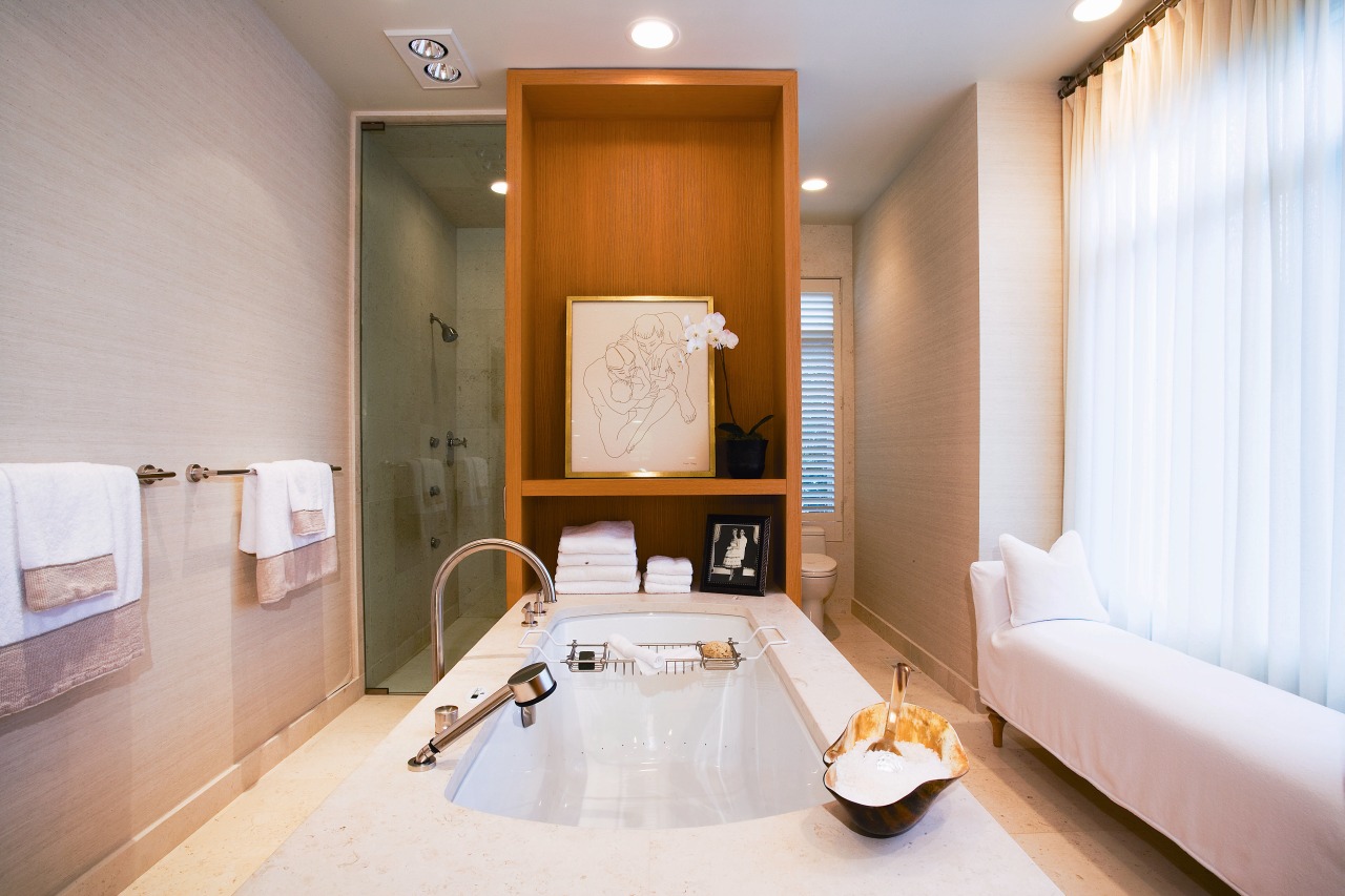 view of the bathroom featuring rift oak cabinetry, bathroom, interior design, real estate, room, suite, gray