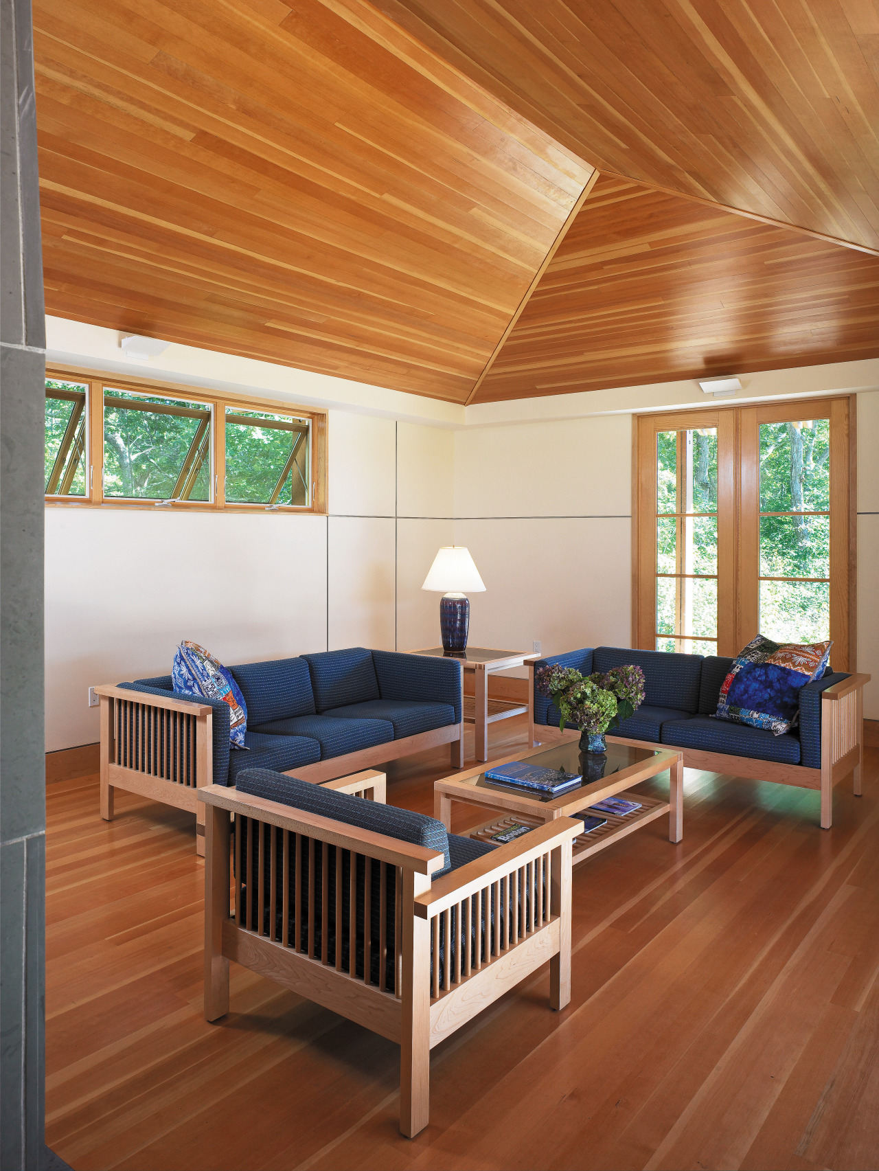 view of the living area featuring fir flooring, bed frame, ceiling, daylighting, estate, floor, flooring, furniture, hardwood, interior design, laminate flooring, living room, real estate, room, table, wood, wood flooring, brown