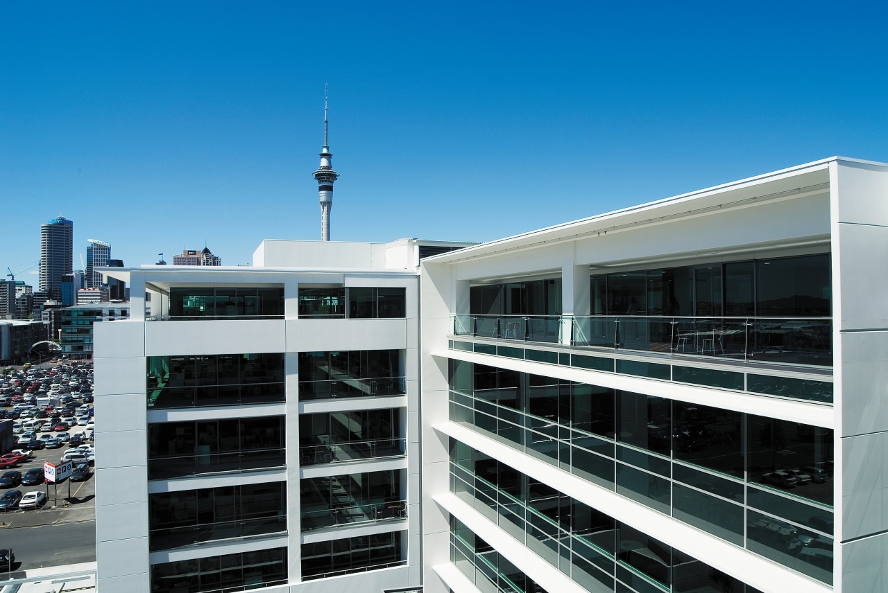 A view of the AirNZ building. architecture, building, city, condominium, corporate headquarters, sky, teal, black