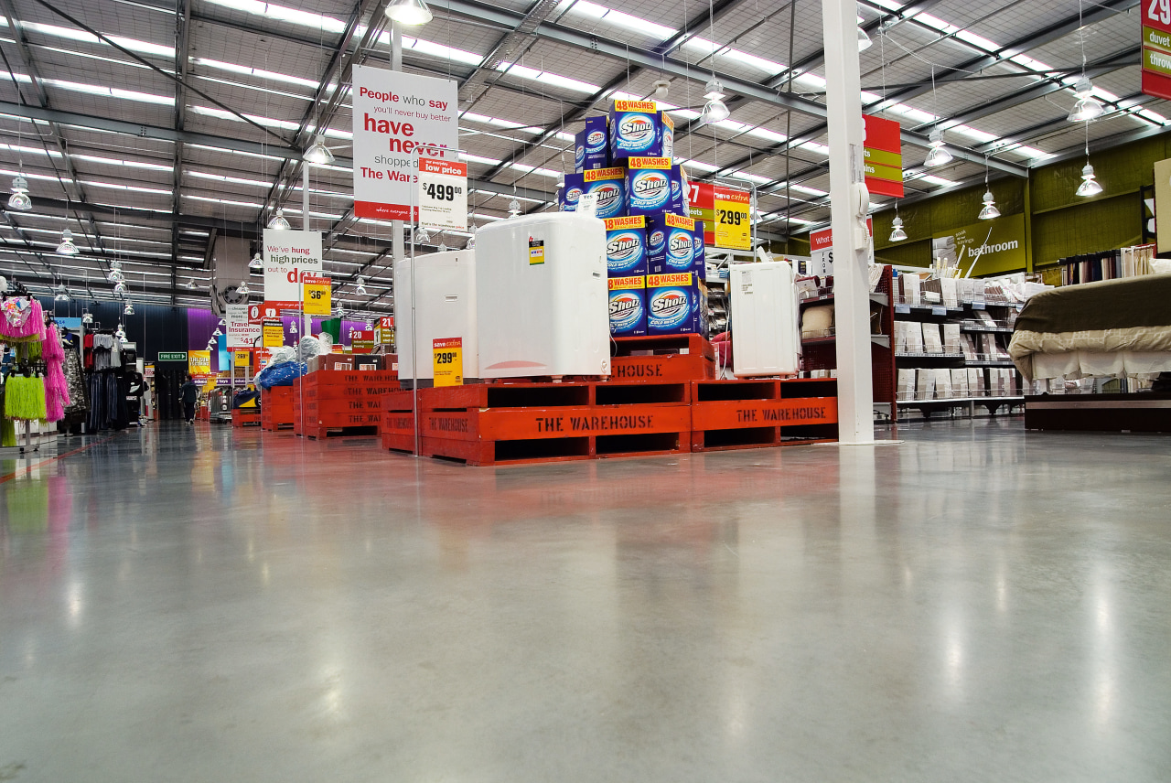 A view of some concrete flooring constructed by factory, manufacturing, warehouse, gray