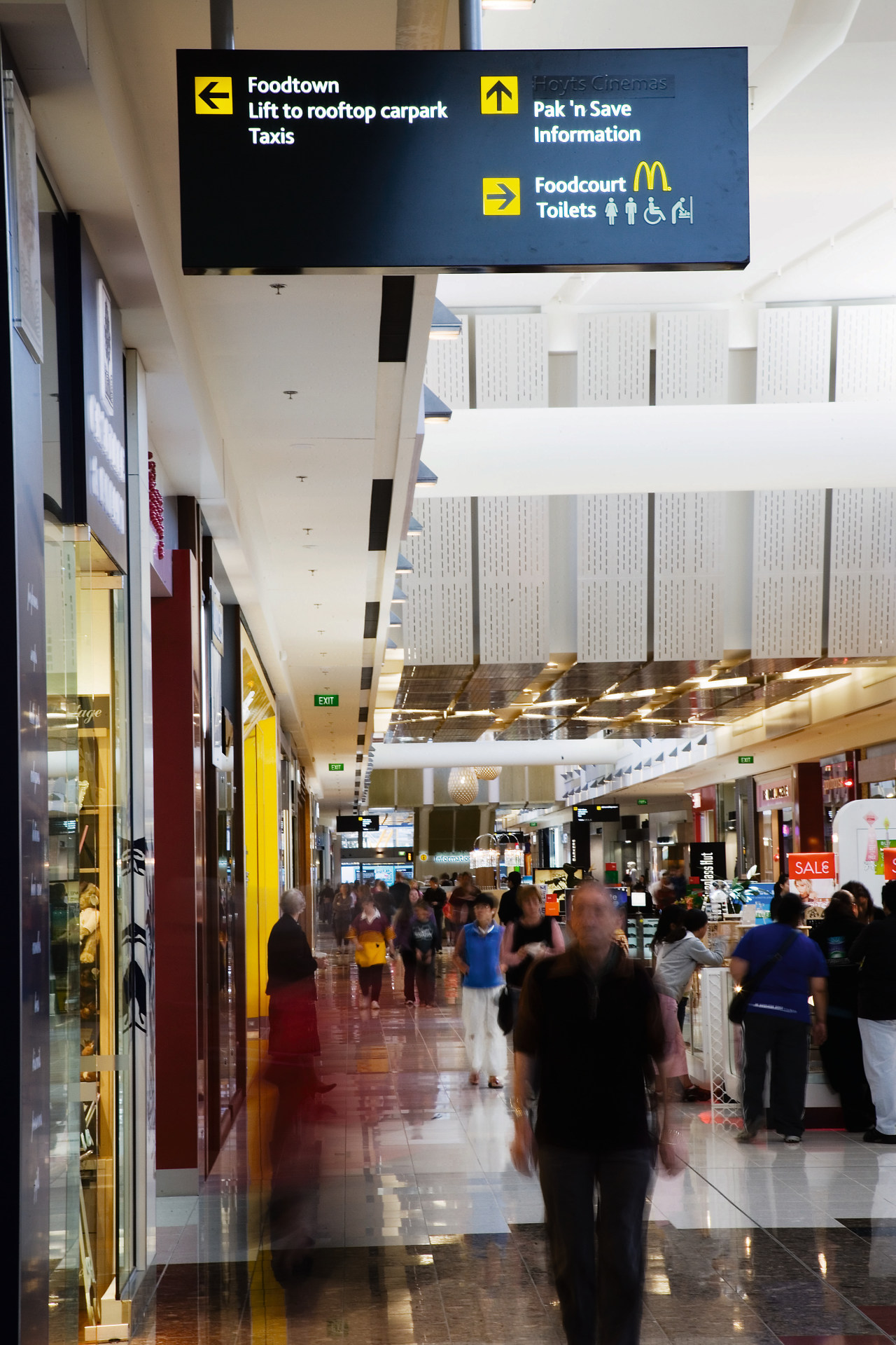 A view of soe signage by Corada. airport, gray