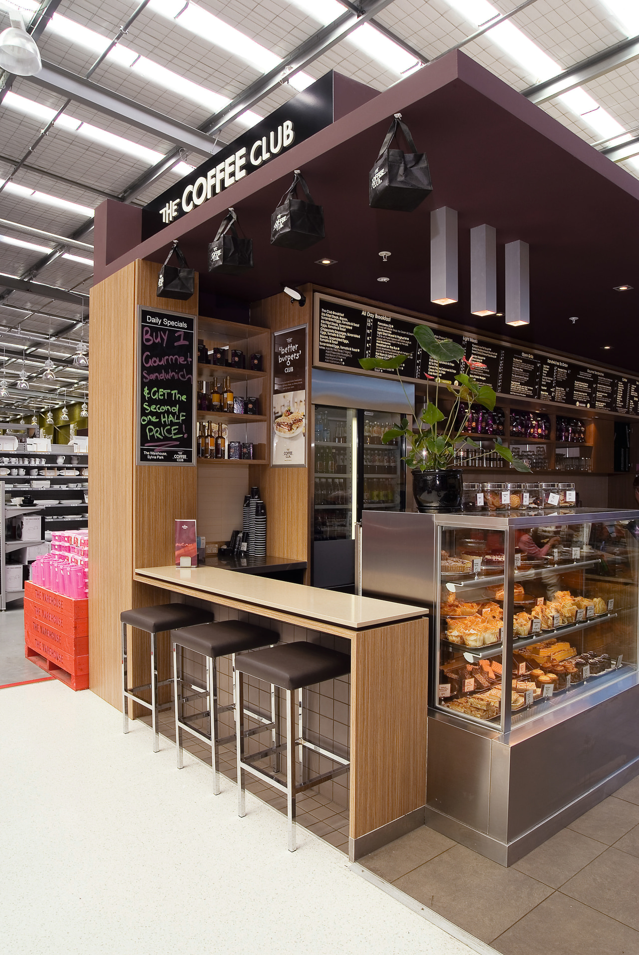 A view of a shop in Sylvia Park café, display case, interior design, retail, table, white, black