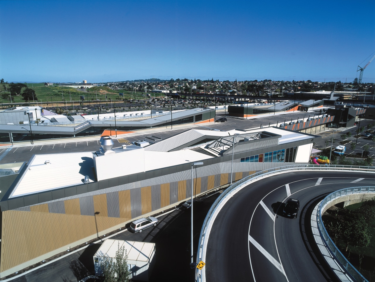 A view of some building materials from Dimond. building, car, city, metropolitan area, road, roof, sky, structure, transport, urban area, black