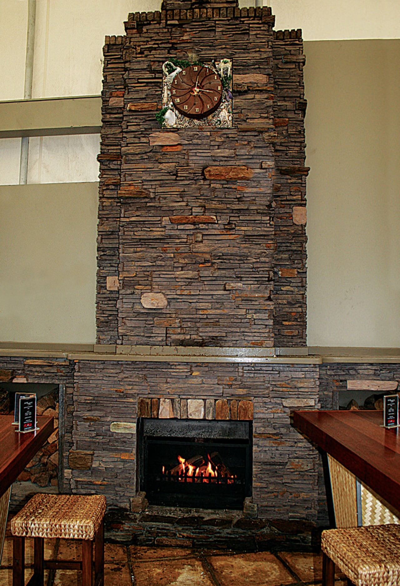 view of the stone fireplace constructed by alpine brick, fireplace, hearth, wall, wood, brown